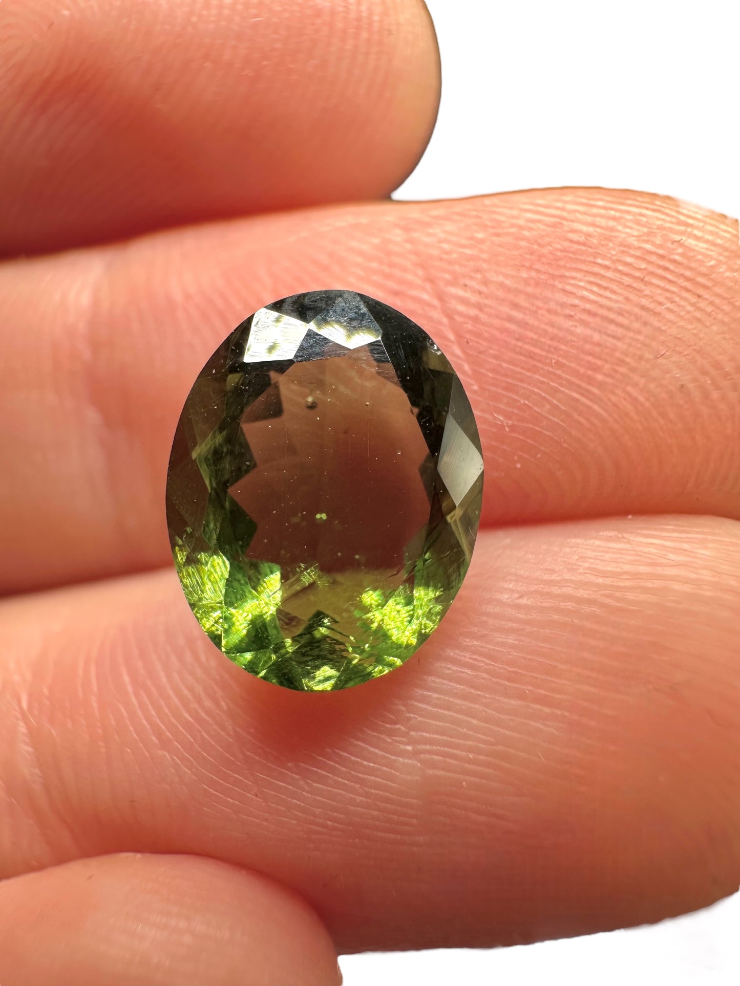 Faceted moldavite in box