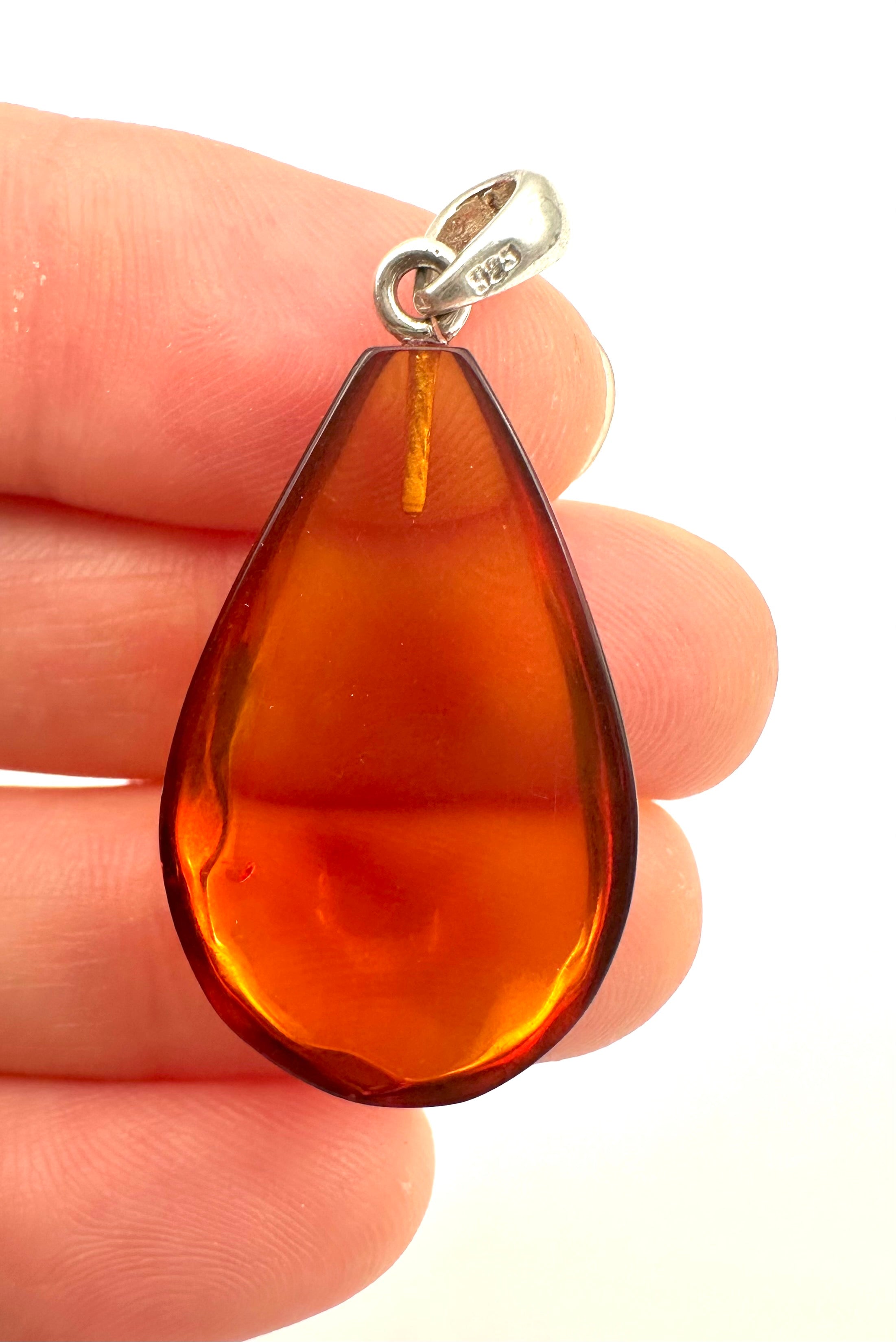 Silver amber pendant