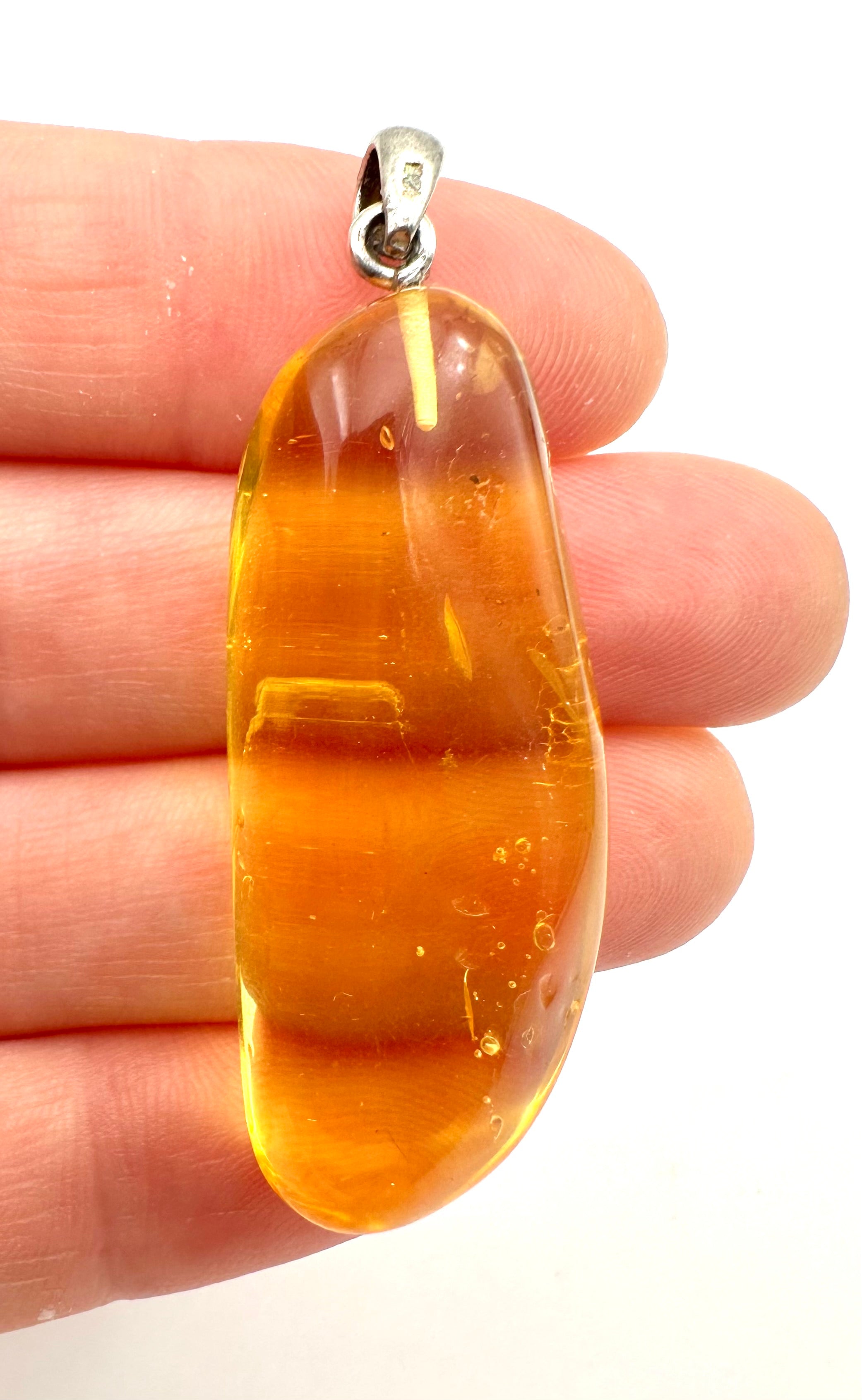 Silver amber pendant