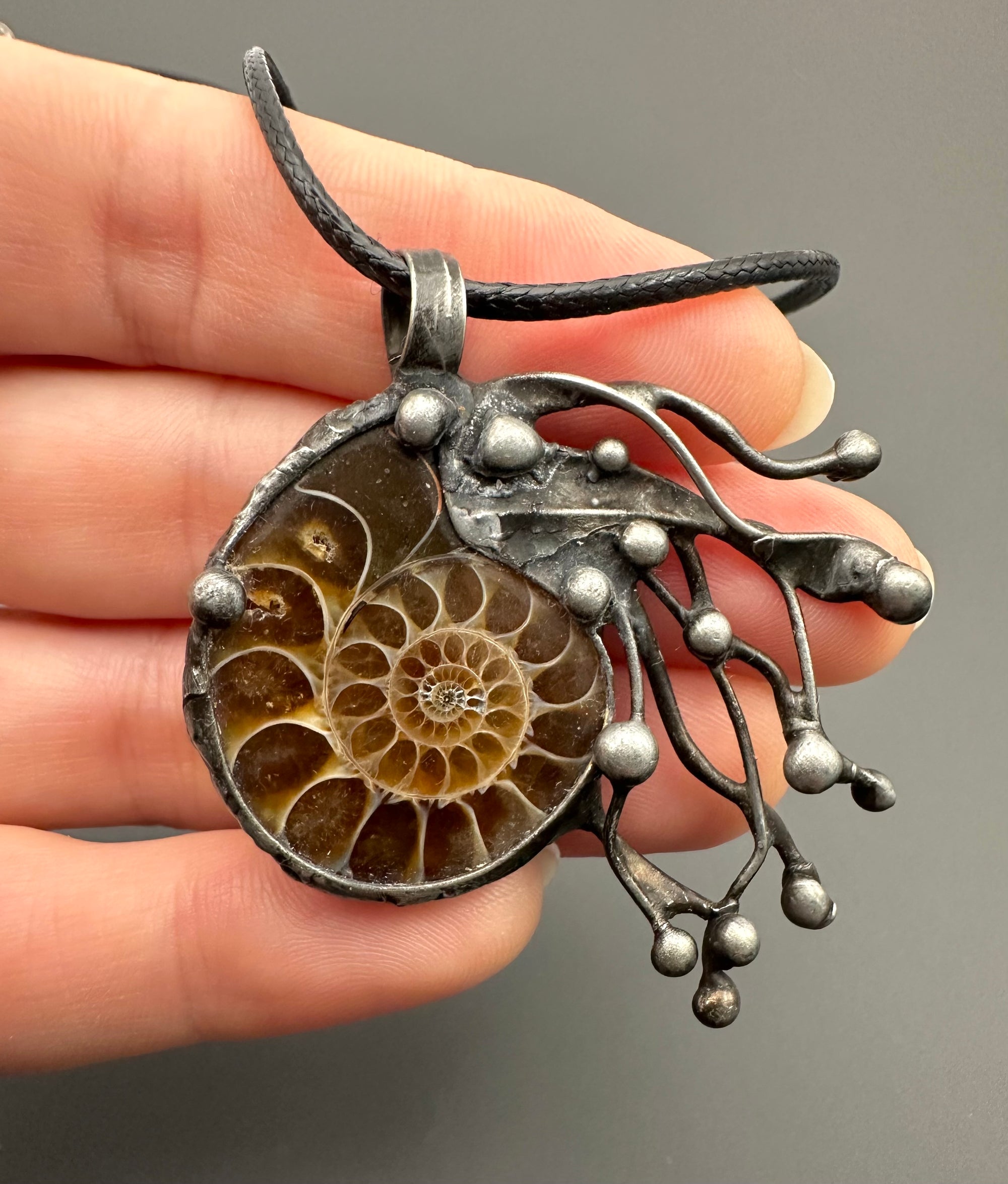 Pendant with ammonite