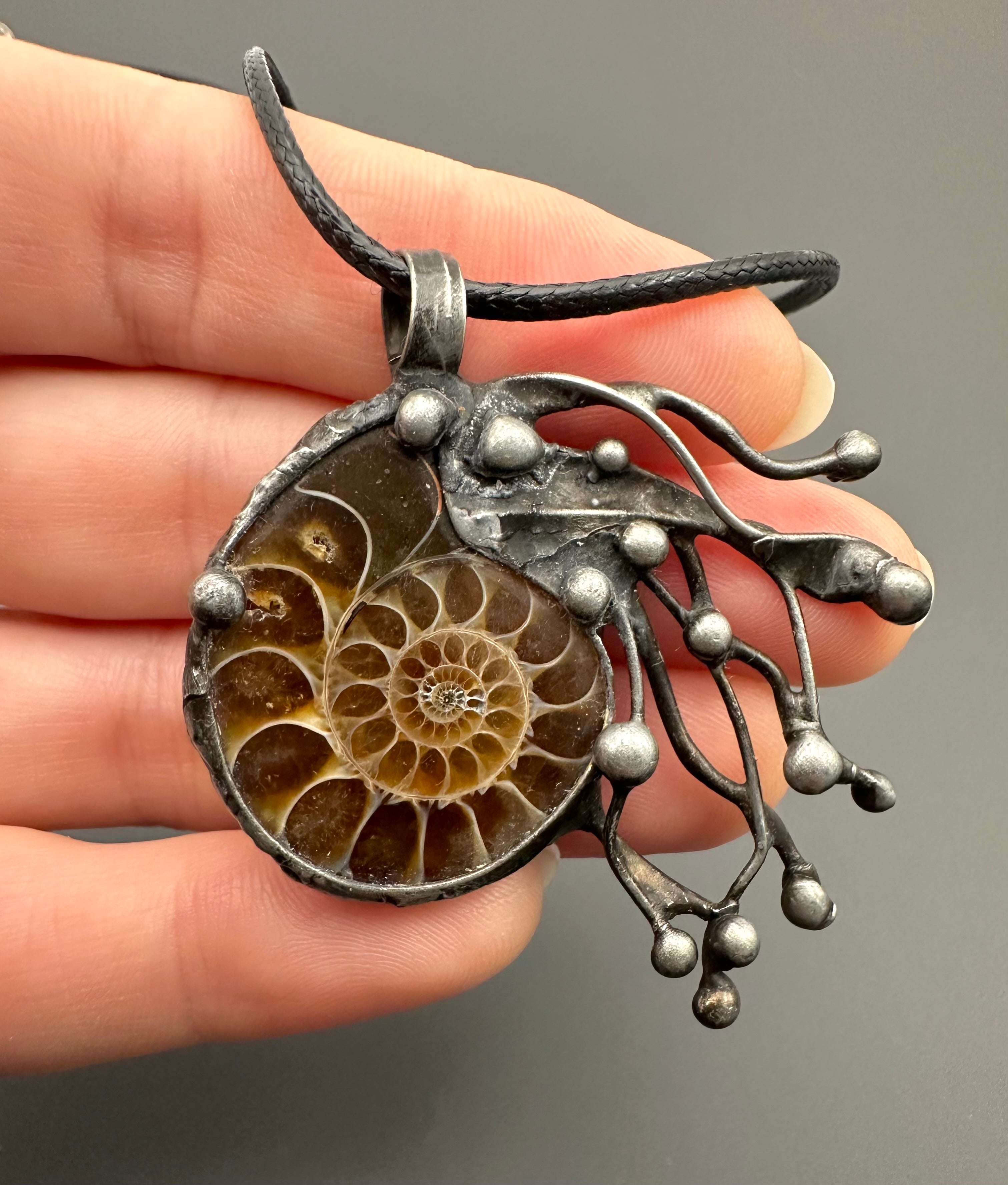Pendant with ammonite