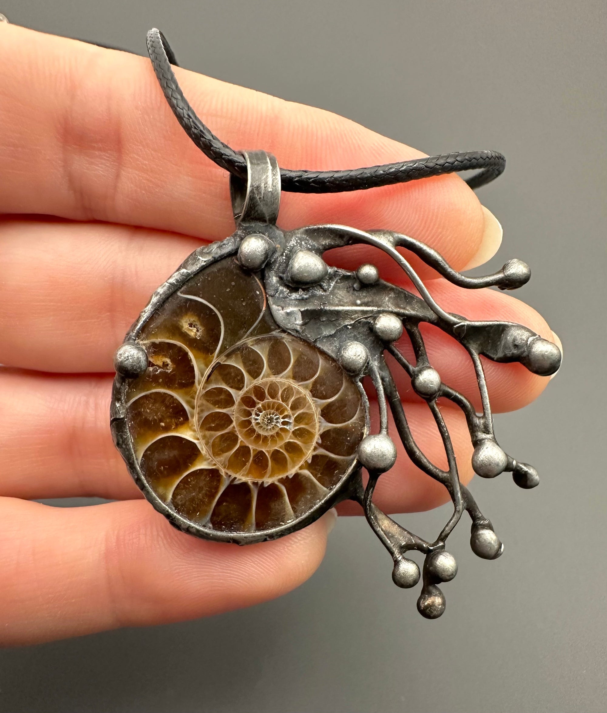 Pendant with ammonite
