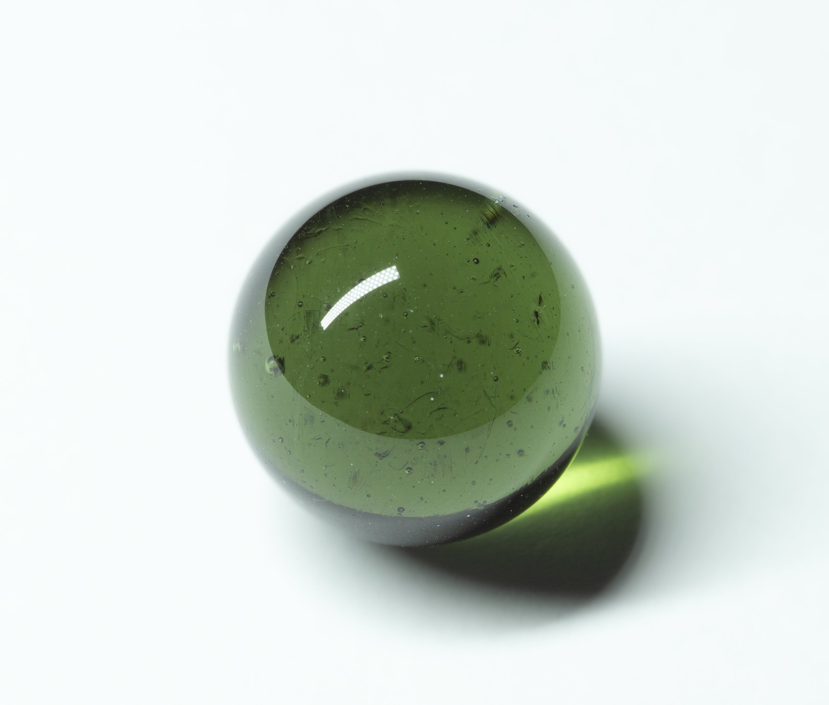 Faceted moldavite 12,55ct – sphere