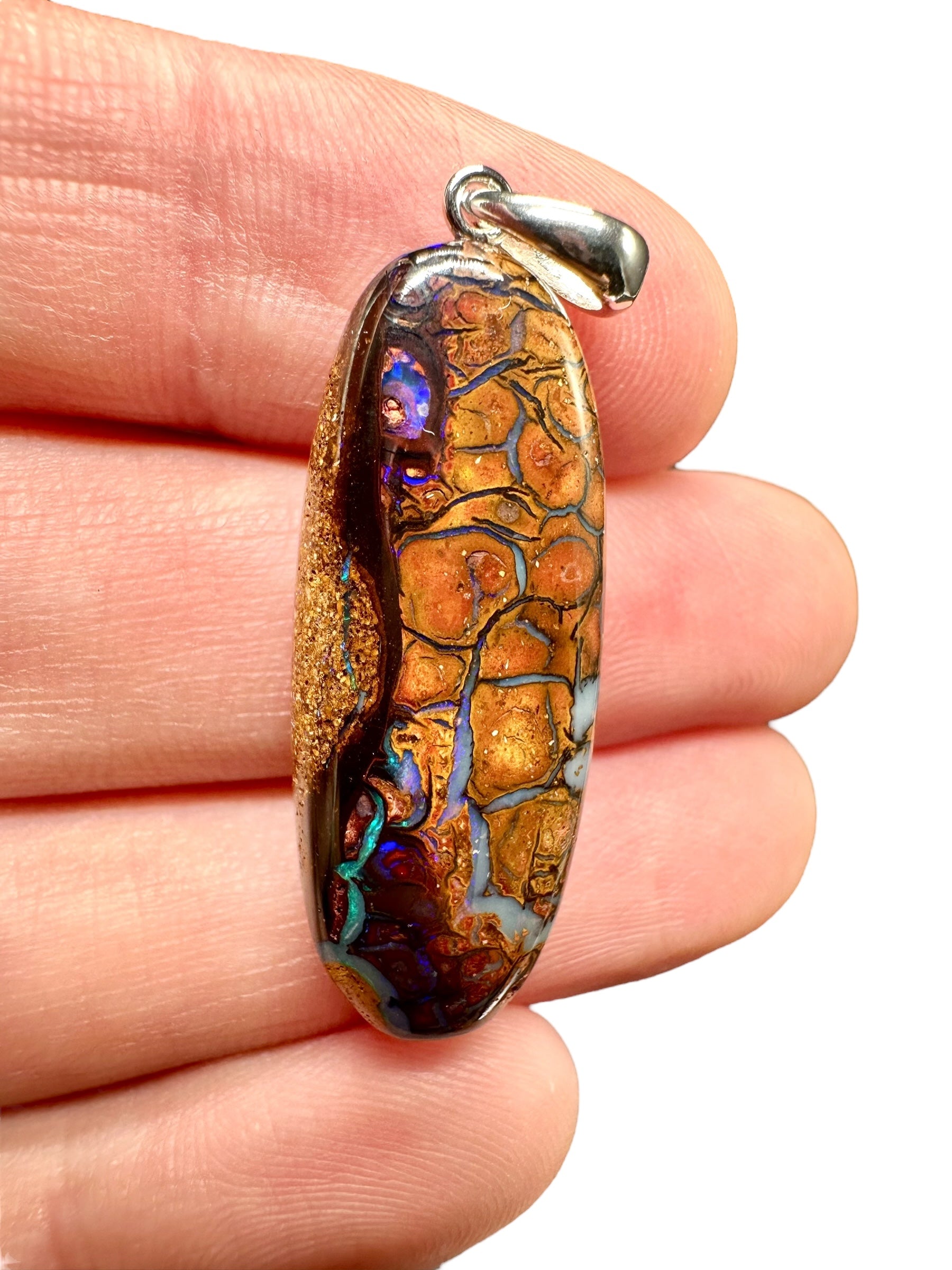 Silver pendant from Australian boulder opal