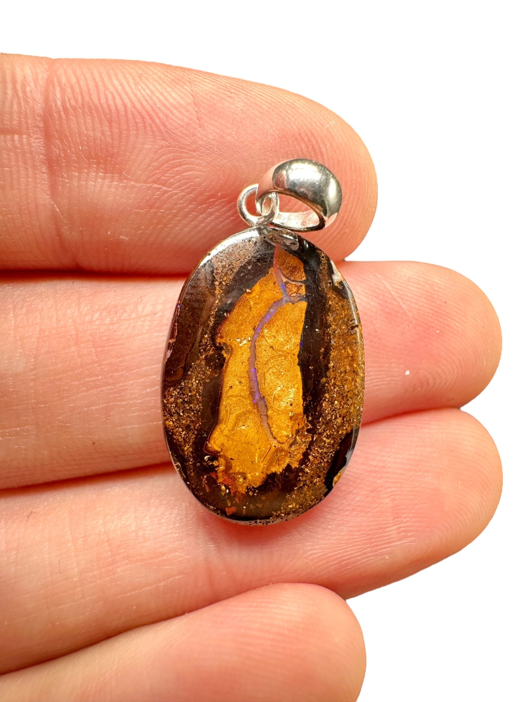 Silver pendant from Australian boulder opal