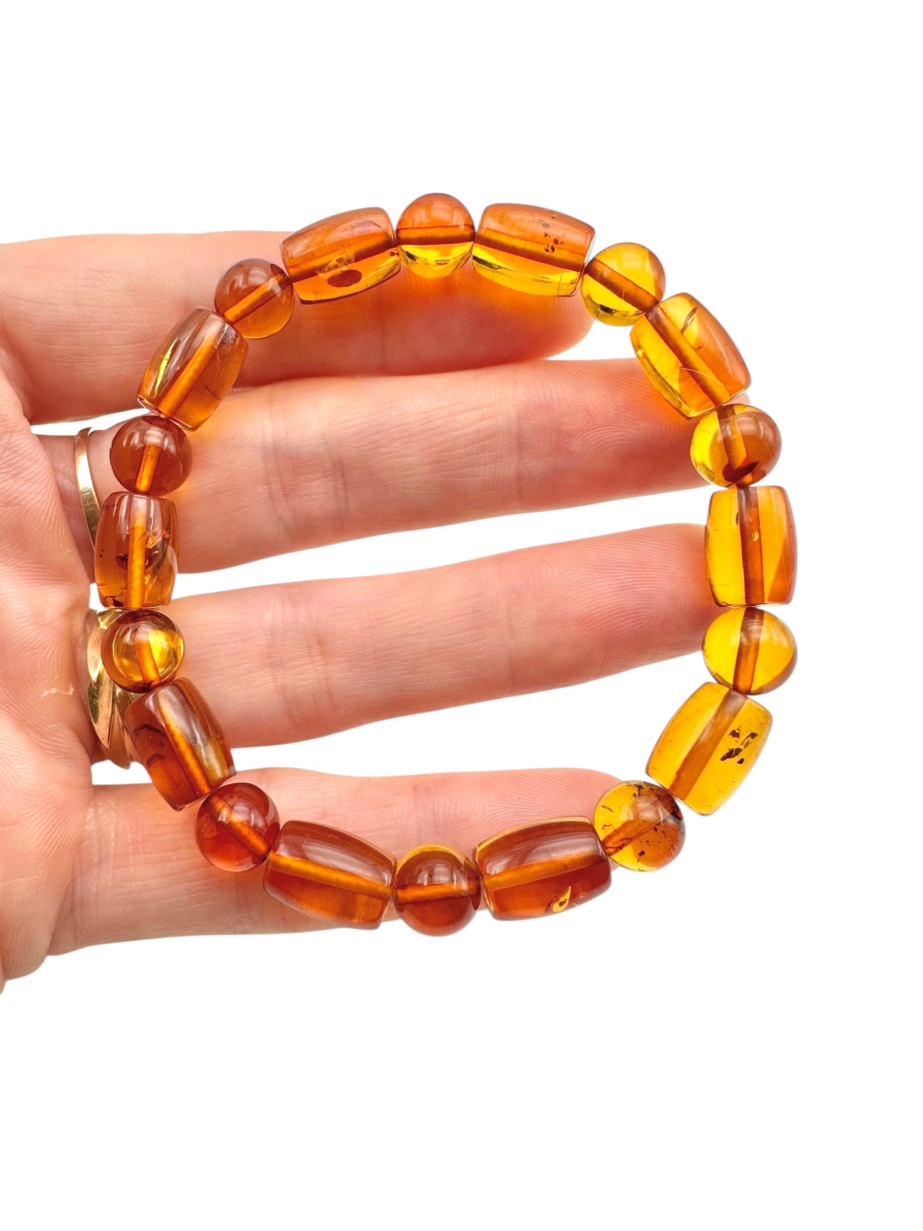 Bracelet made of polished genuine amber spheres / random piece