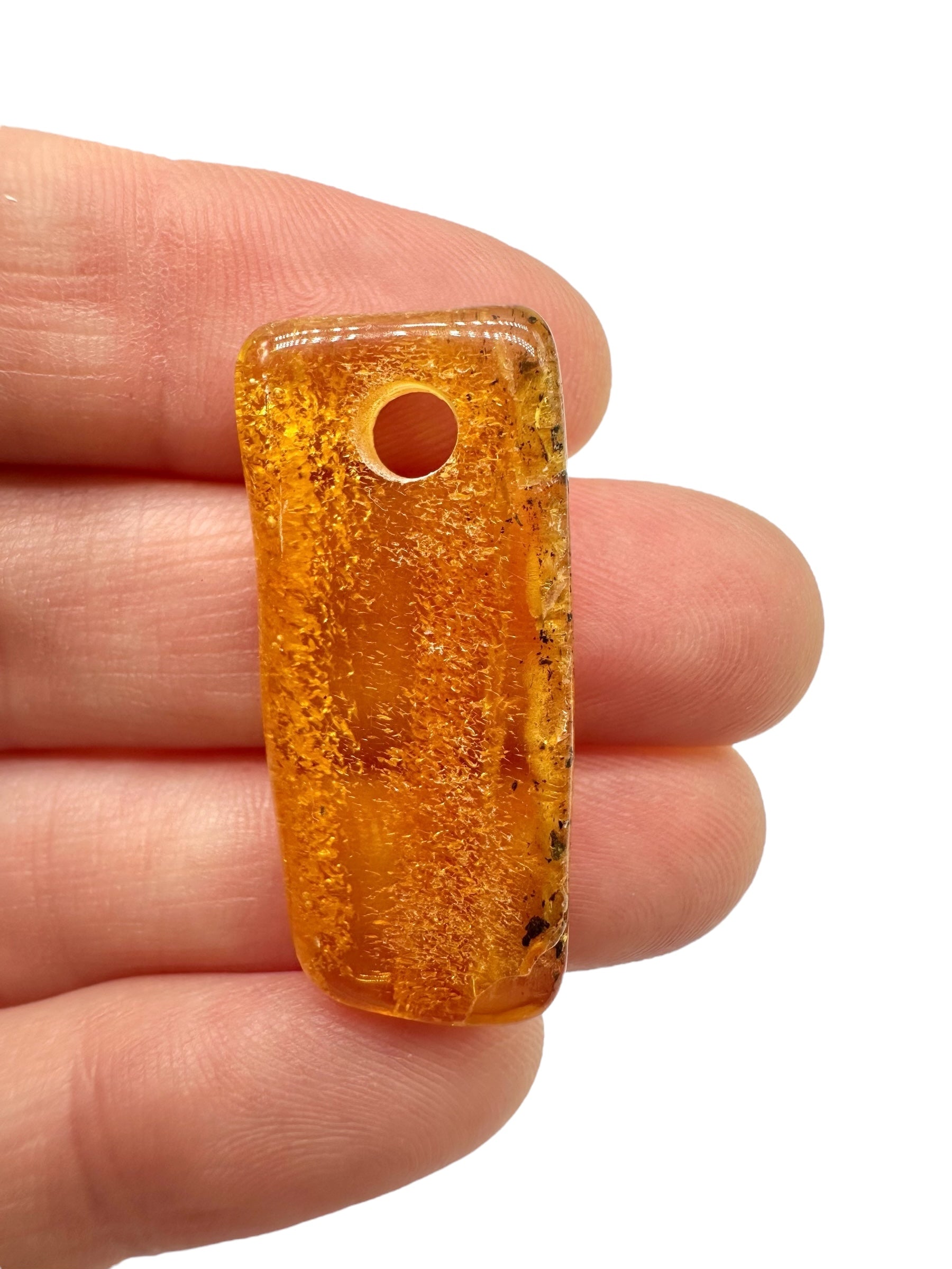 Amber with a drilled hole for hanging 1,8g – Lithuania