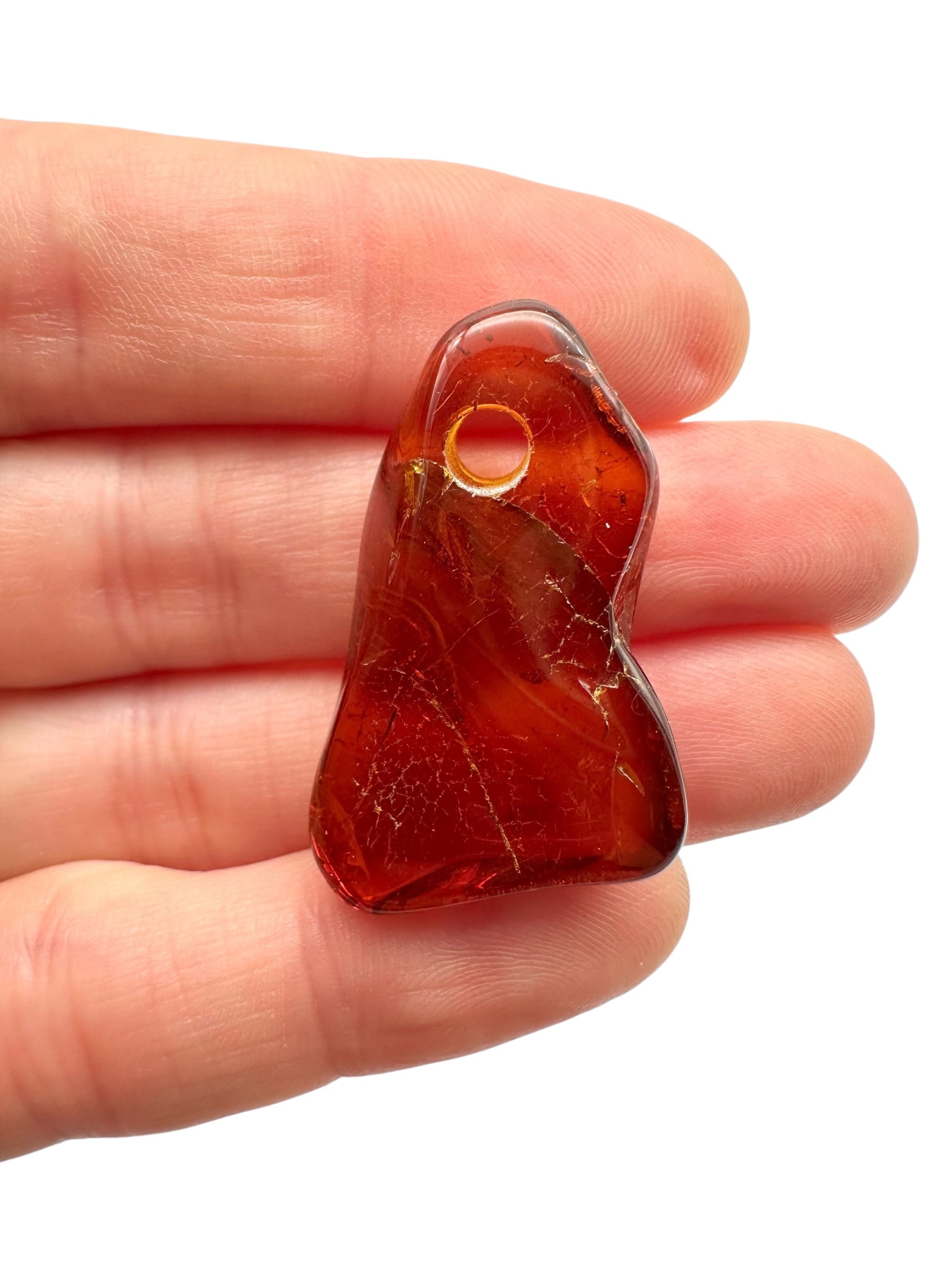 Amber with a drilled hole for hanging 2,9g – Lithuania