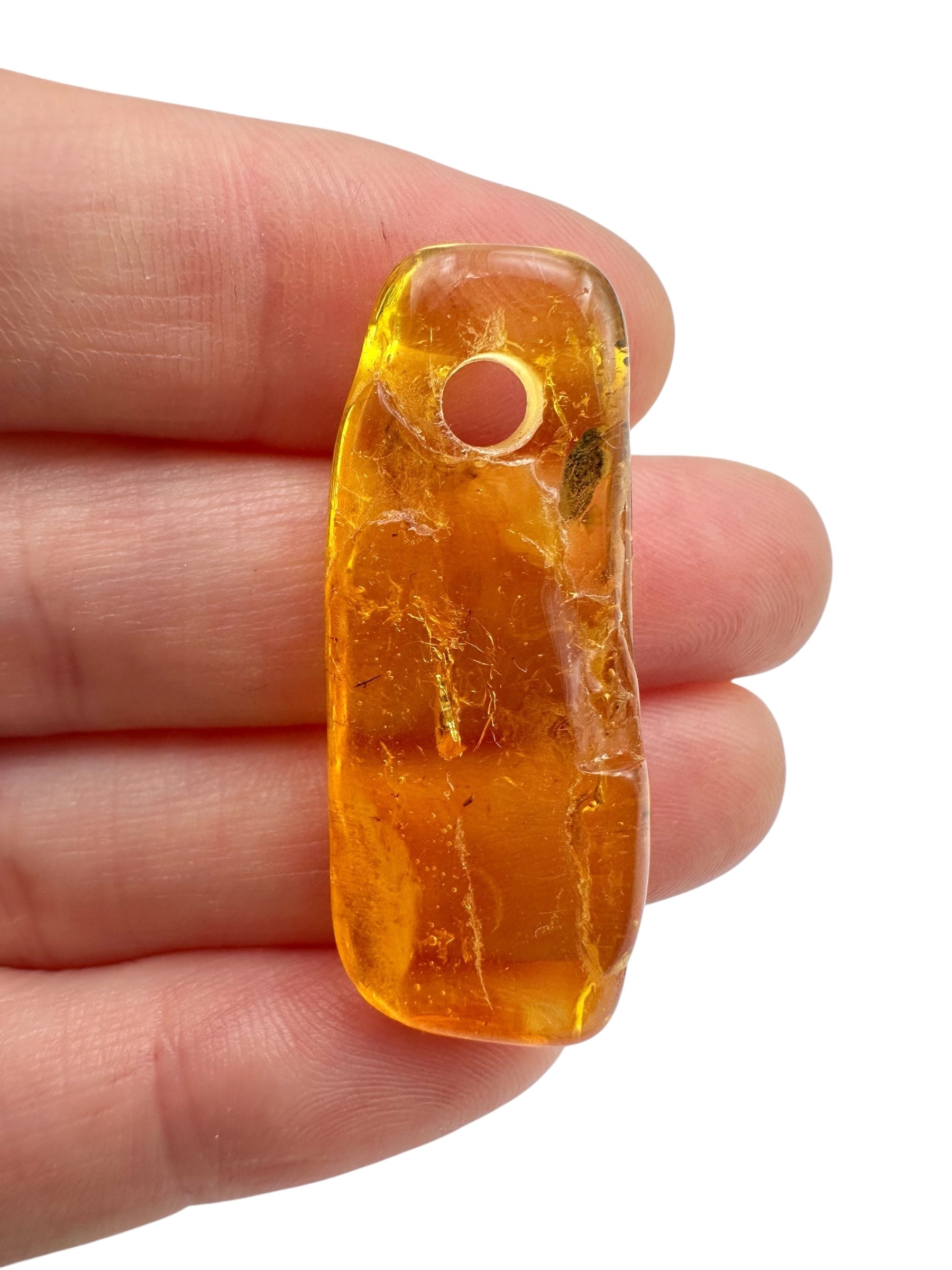 Amber with a drilled hole for hanging 2,3g – Lithuania
