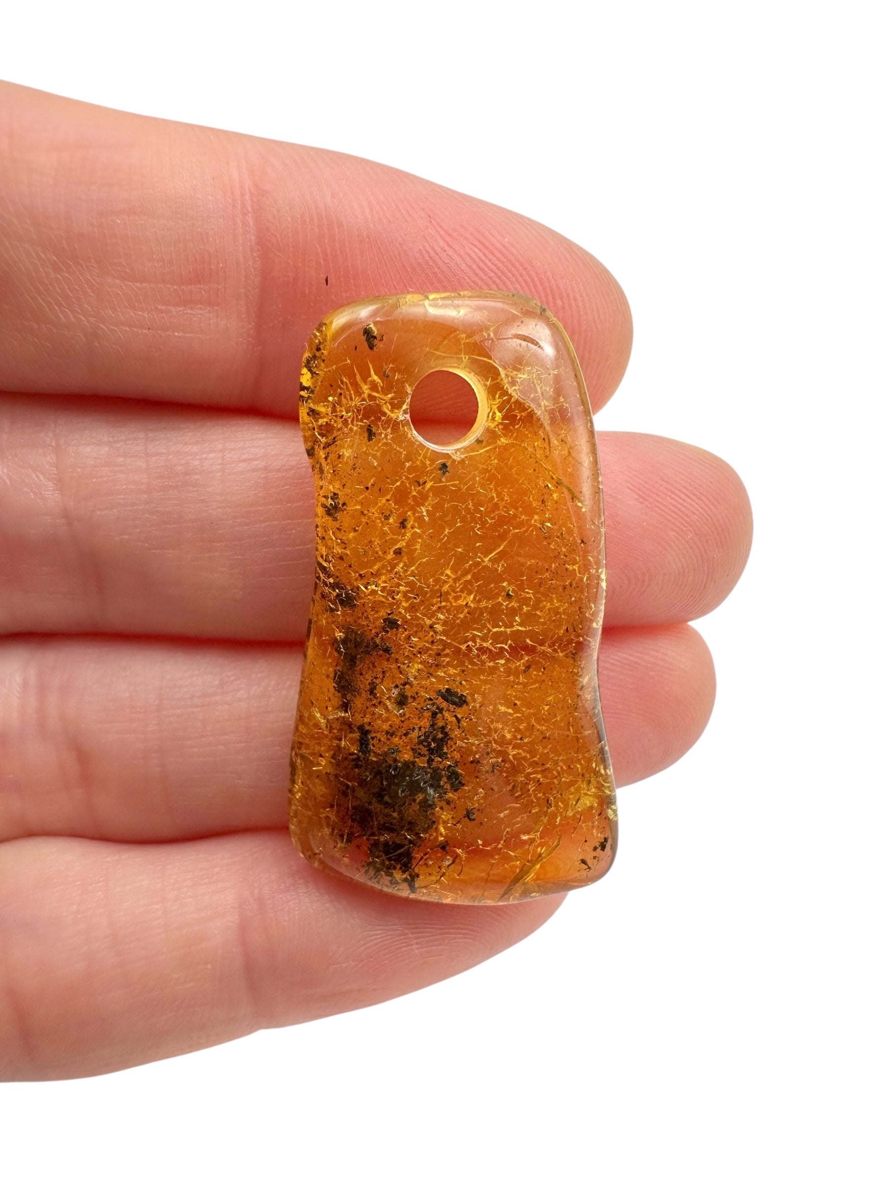 Amber with a drilled hole for hanging 2,6g – Lithuania