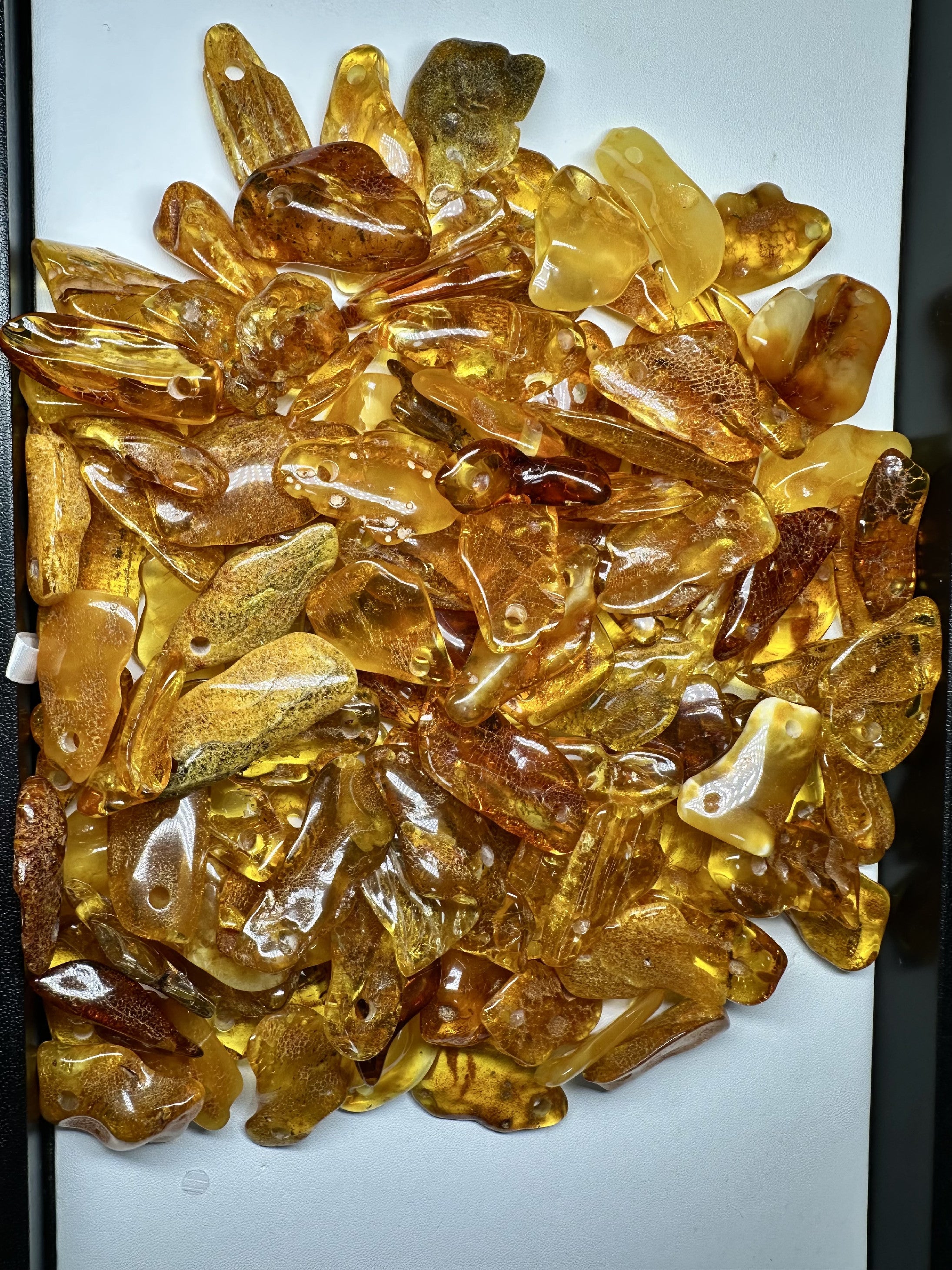Amber with a drilled hole (polished) – Lithuania – 310g - JVEL01