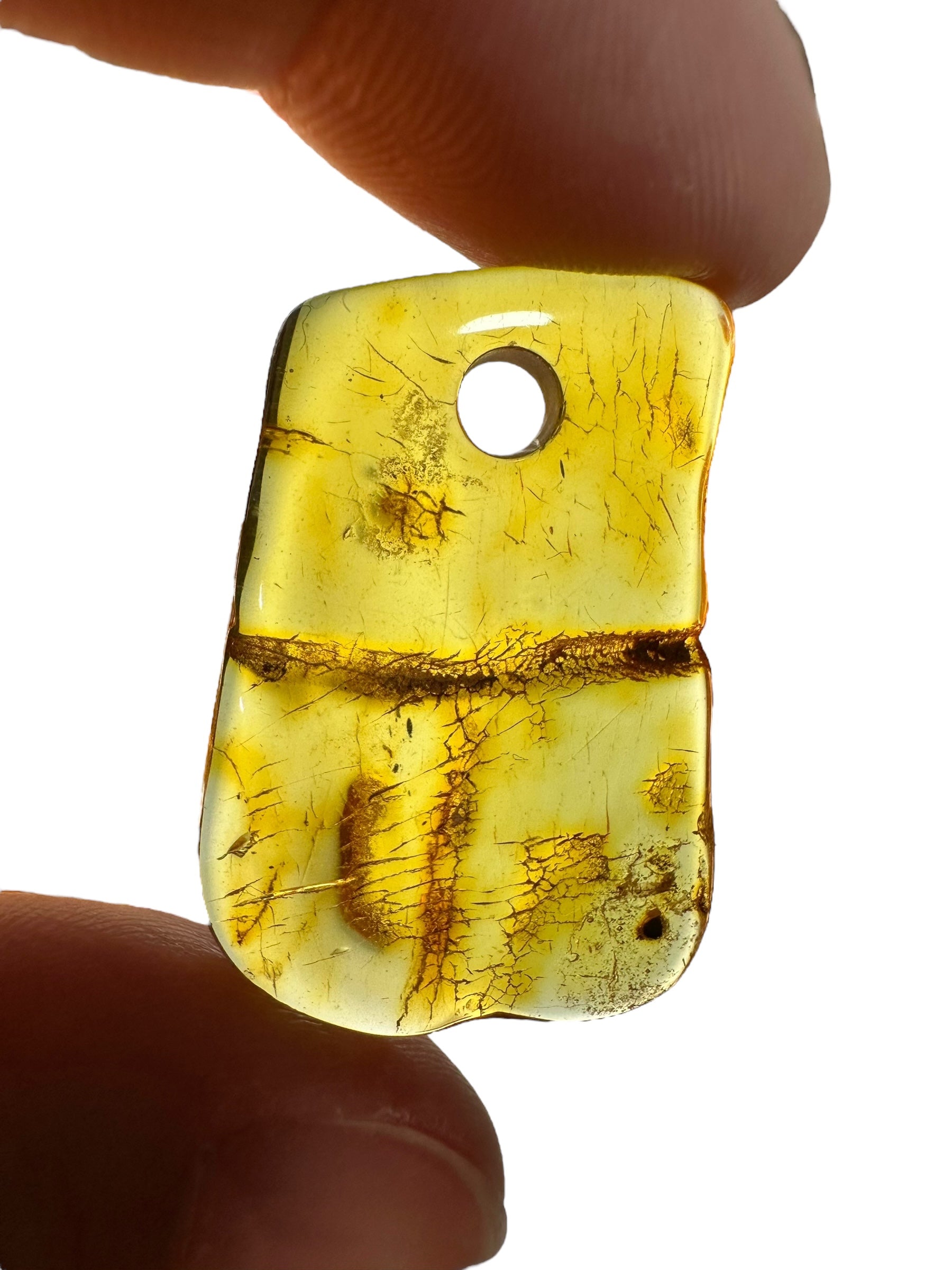 Amber with a drilled hole (polished) – Lithuania – 310g - JVEL01