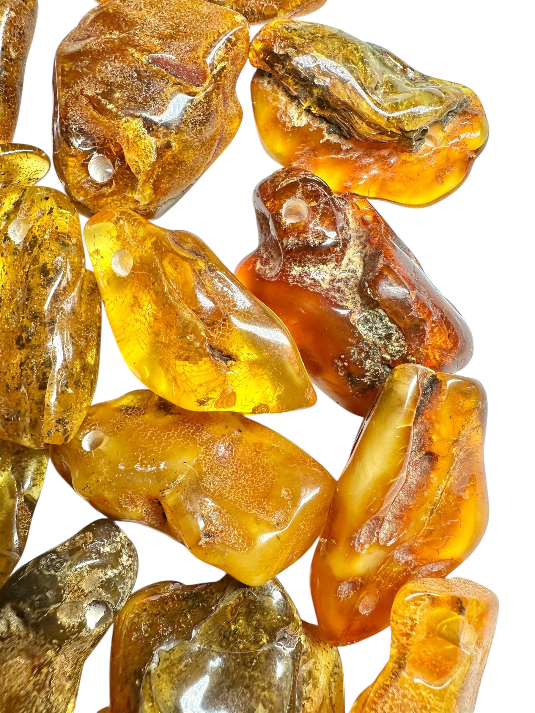 Amber with a drilled hole (polished) – Lithuania – 255g - JVEL03