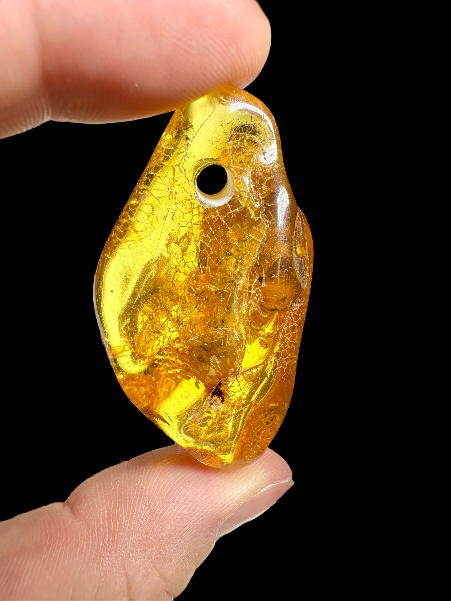 Amber with a drilled hole (polished) – Lithuania – 255g - JVEL03