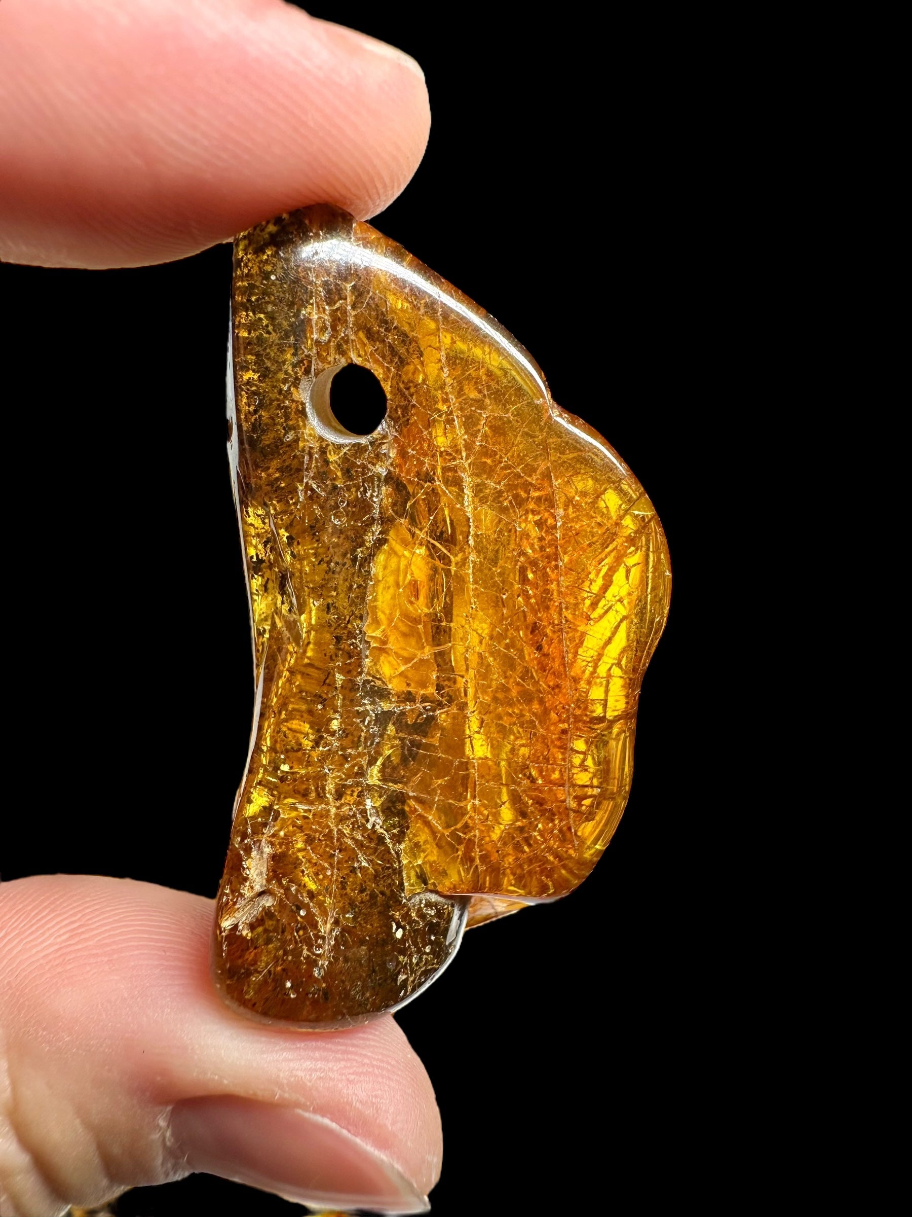 Amber with a drilled hole (polished) – Lithuania – 255g - JVEL03