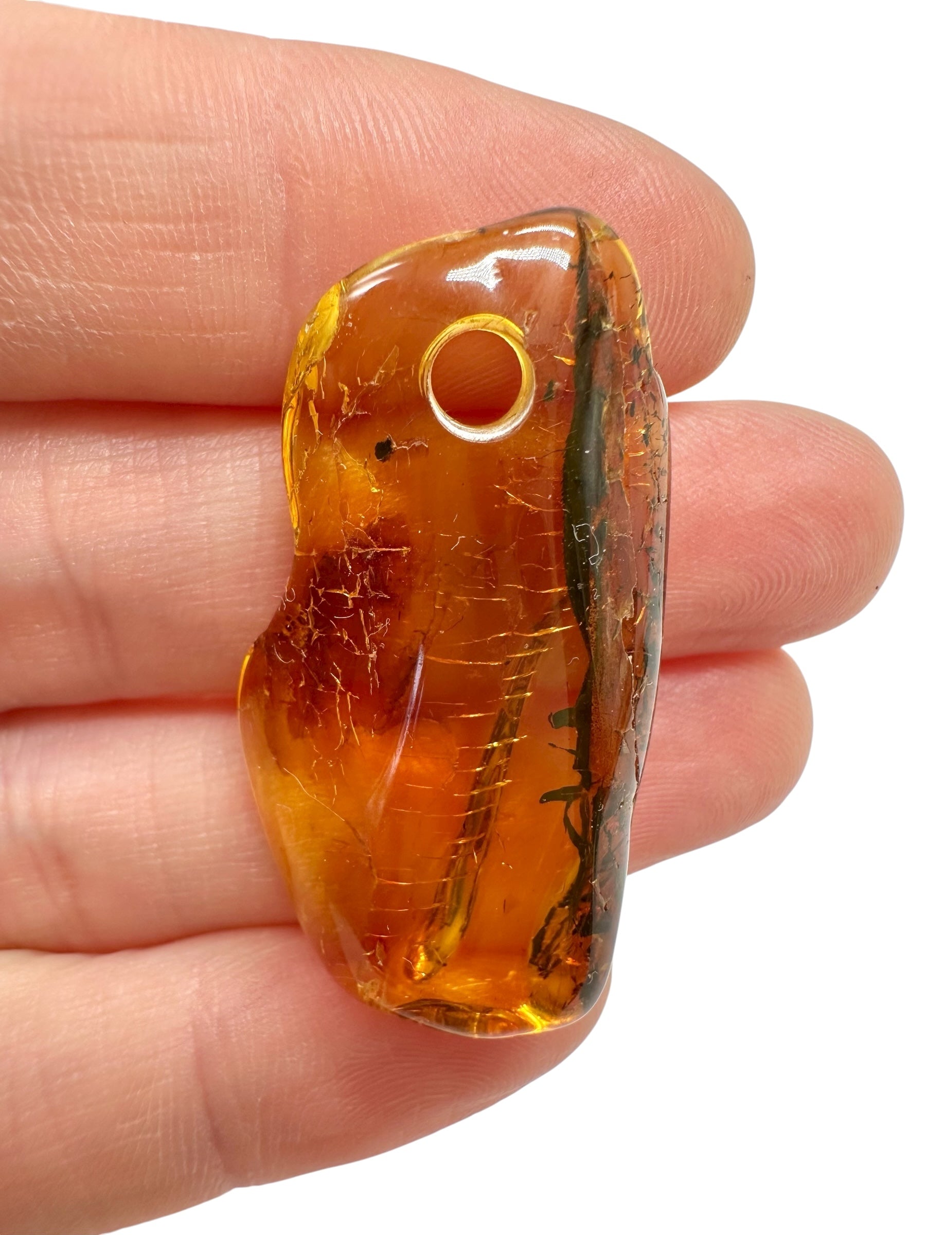 Amber with a drilled hole for hanging 3g – Lithuania