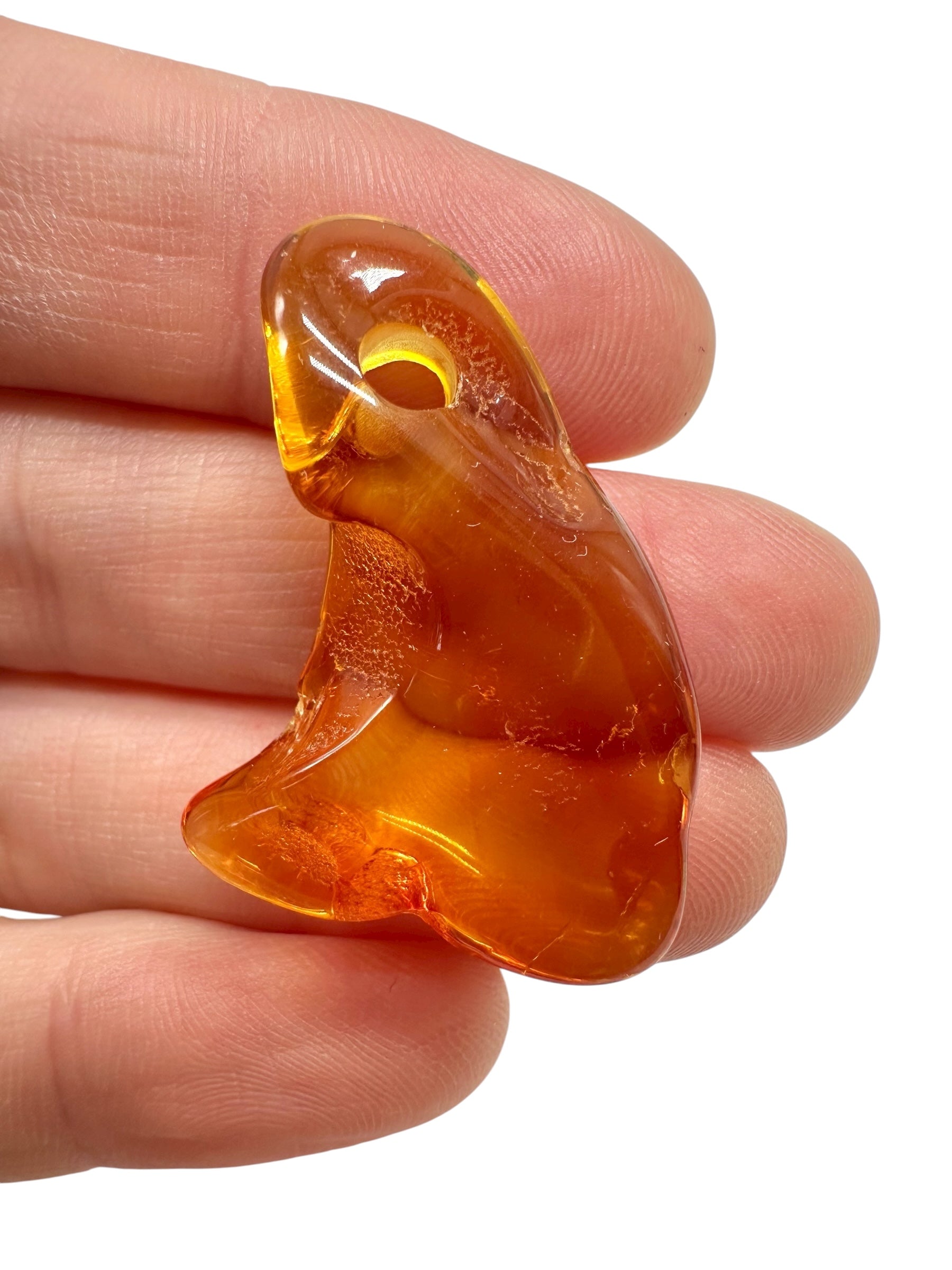 Amber with a drilled hole for hanging 2,1g – Lithuania