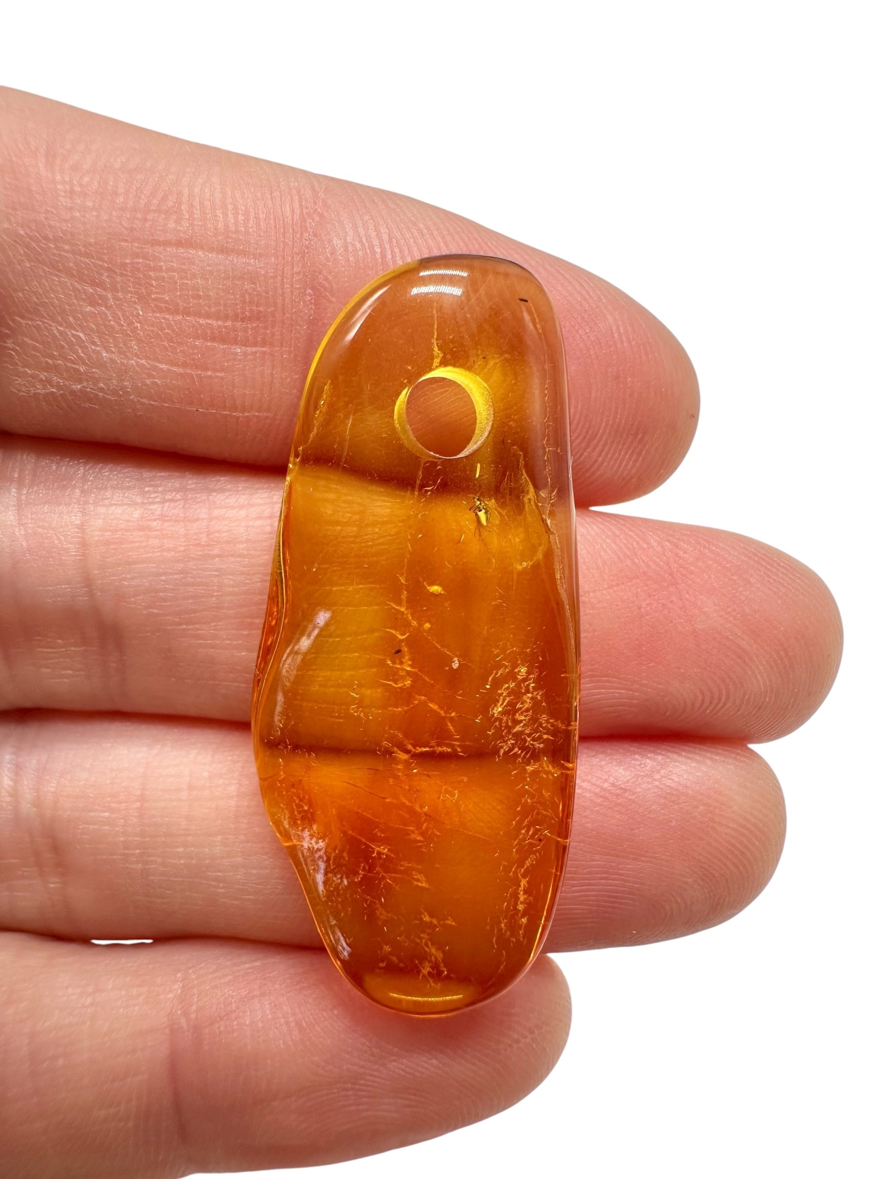 Amber with a drilled hole for hanging 1,7g – Lithuania - JND41