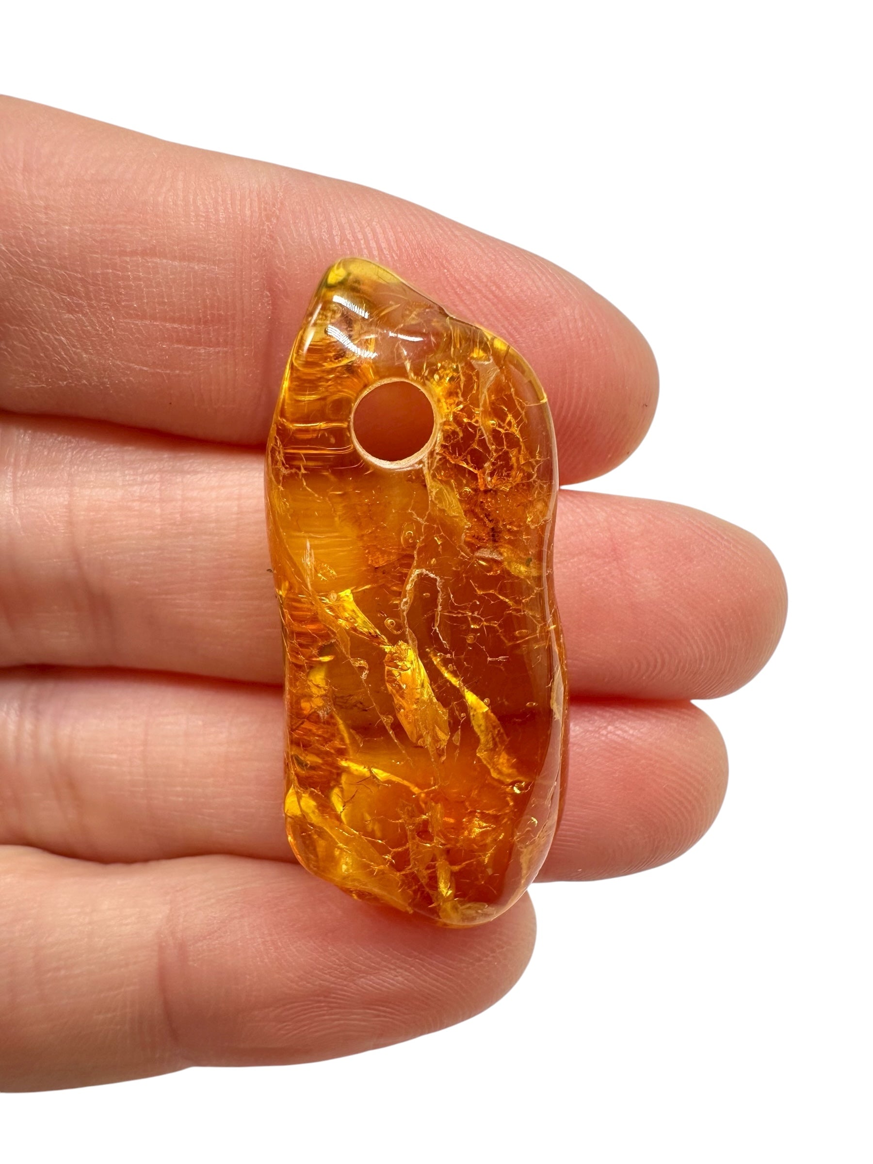 Amber with a drilled hole for hanging 2,8g – Lithuania