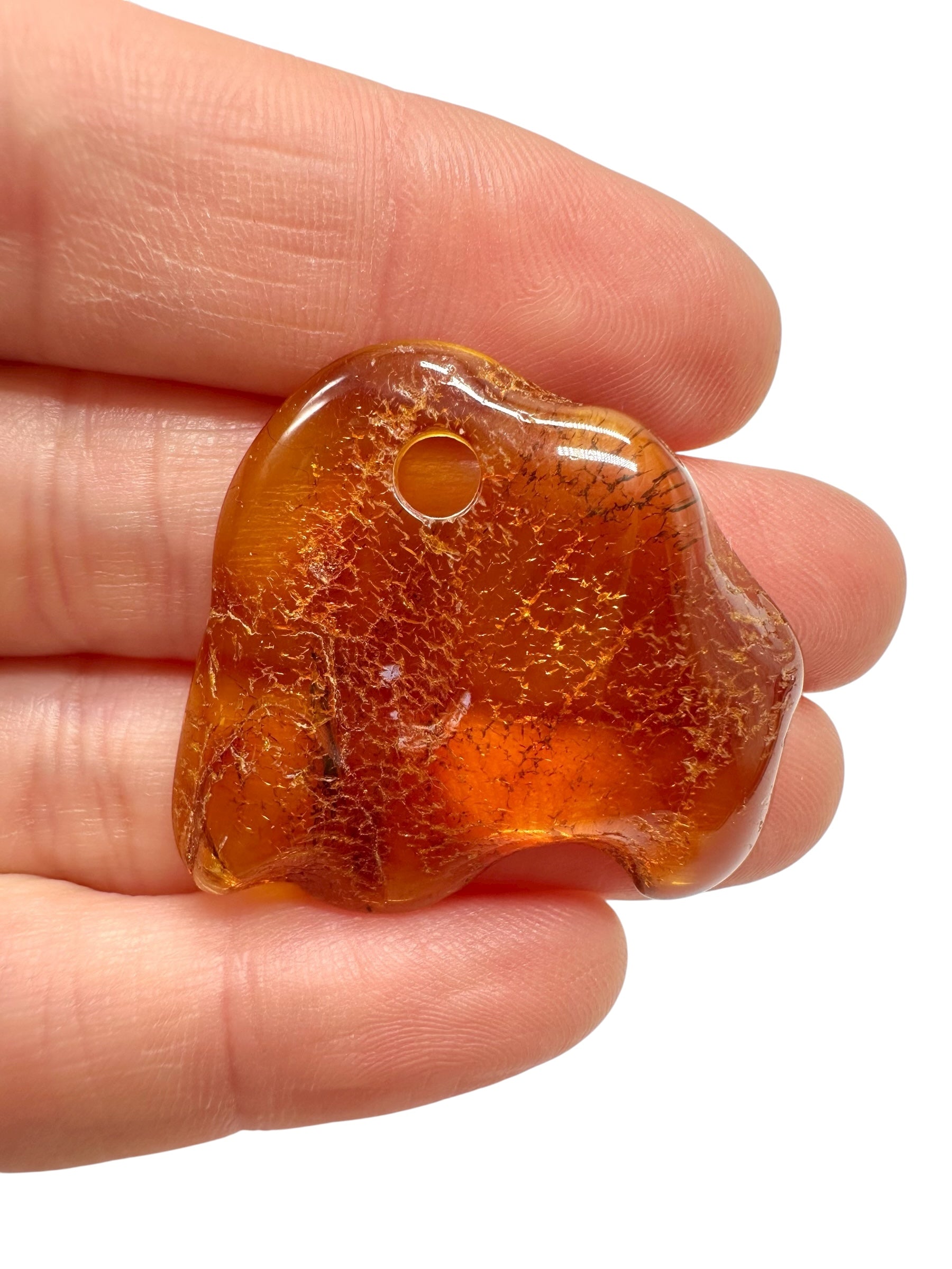 Amber with a drilled hole for hanging 3,4g – Lithuania