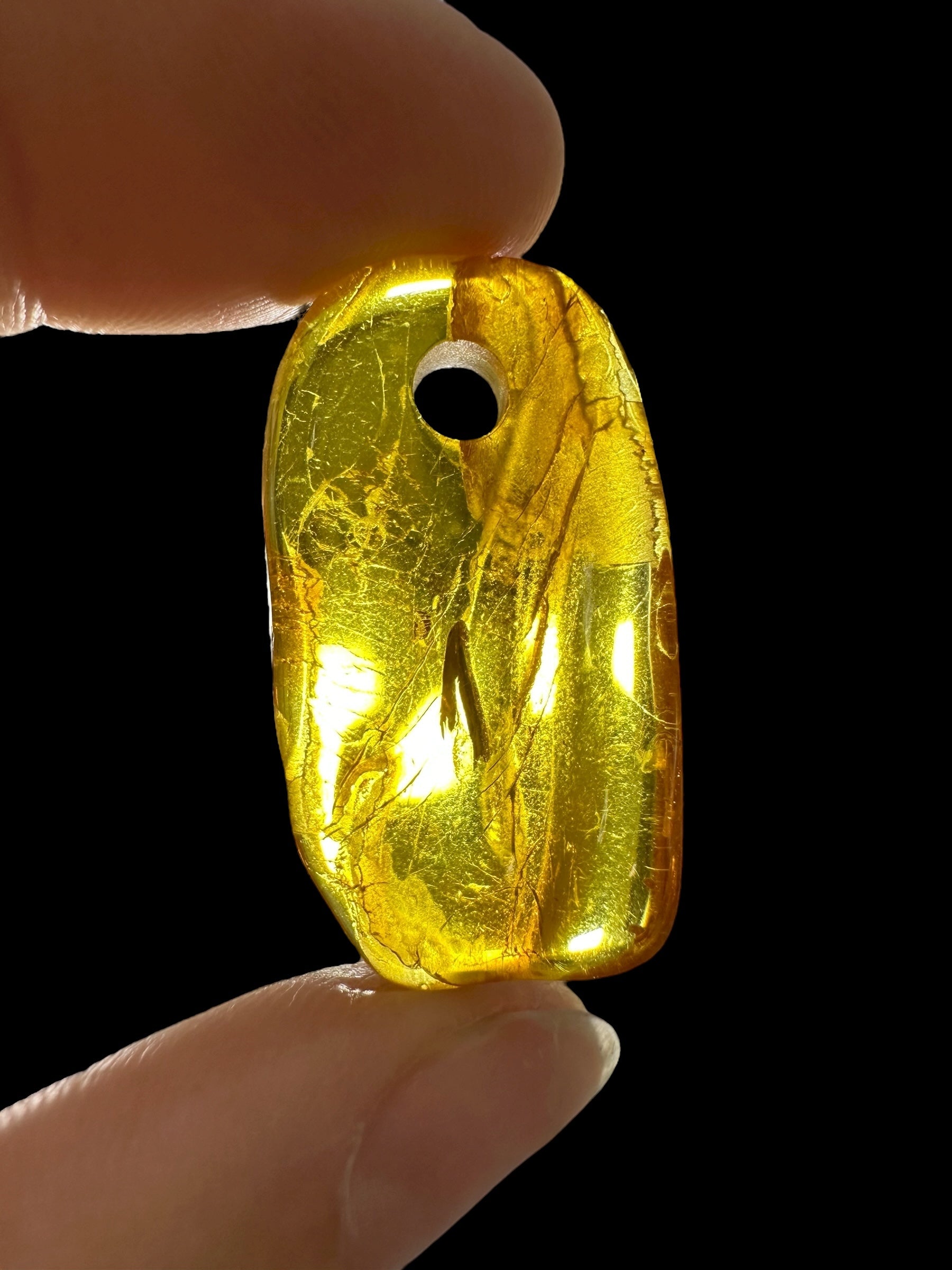Amber with a drilled hole for hanging 1,8g – Lithuania - JND46