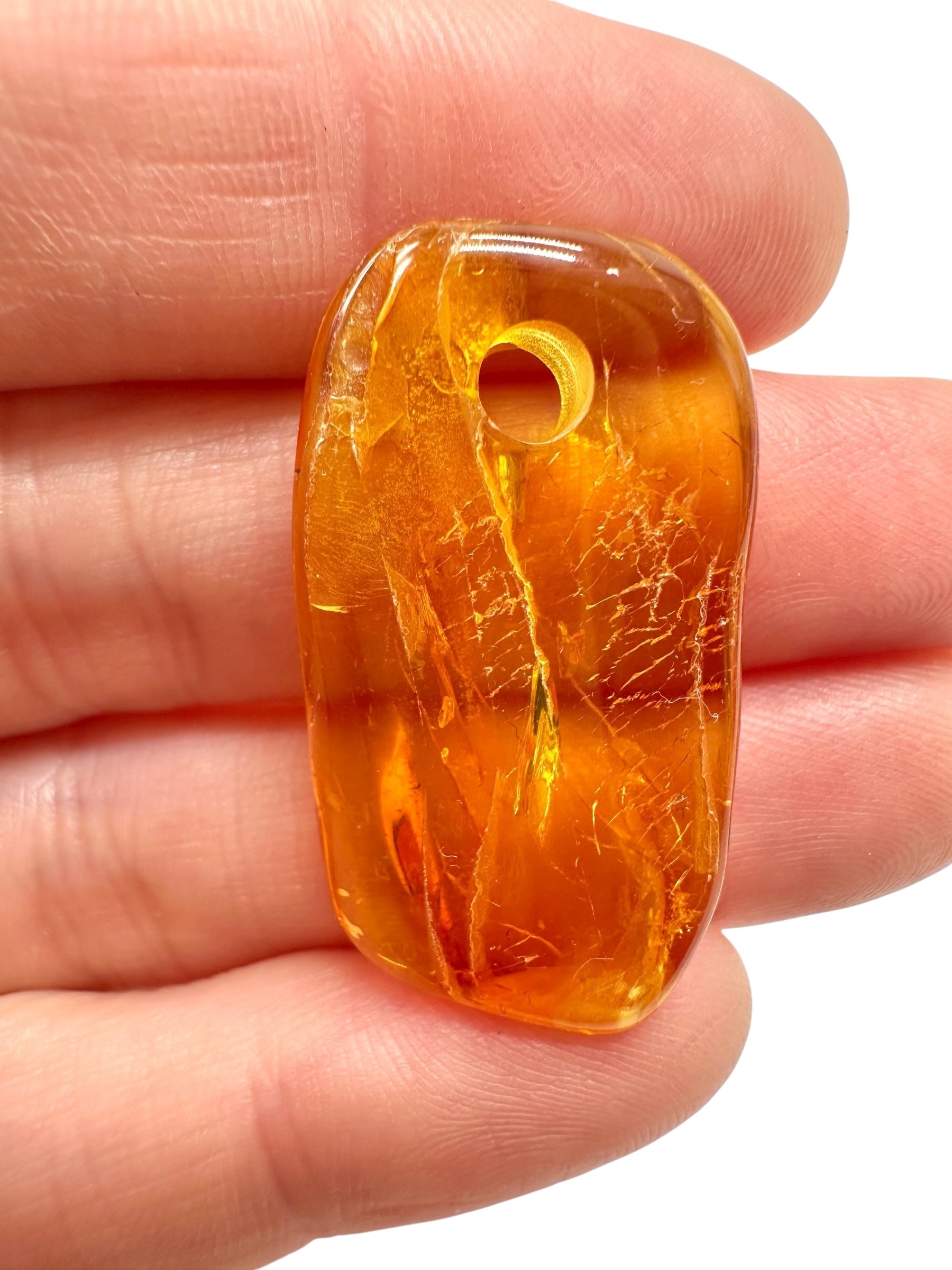 Amber with a drilled hole for hanging 1,8g – Lithuania