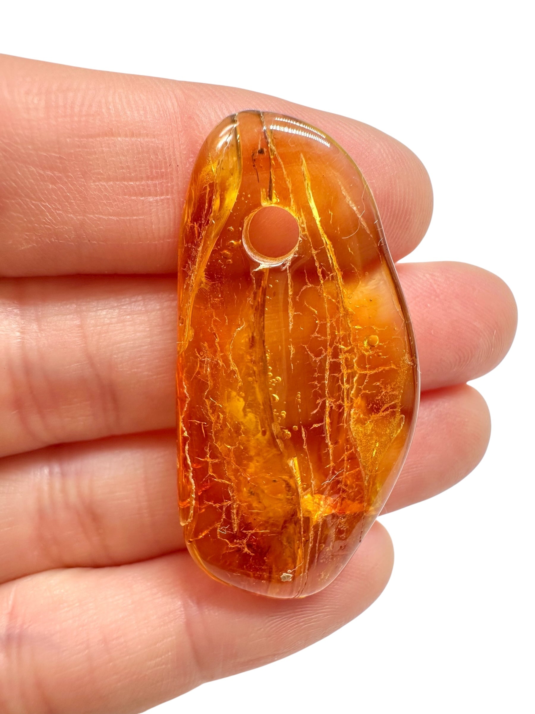 Amber with a drilled hole for hanging 3g – Lithuania