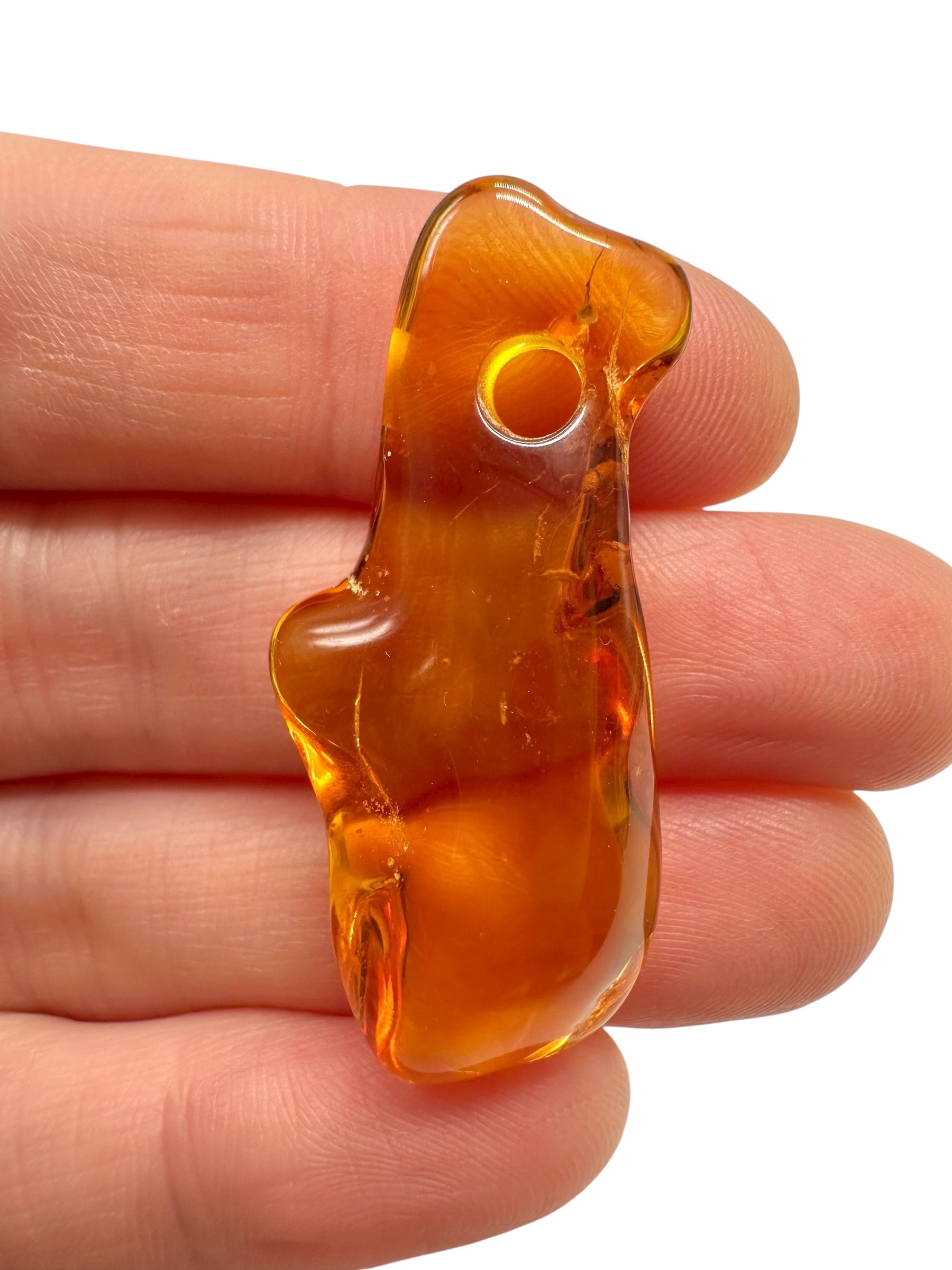 Amber with a drilled hole for hanging 2,4g – Lithuania