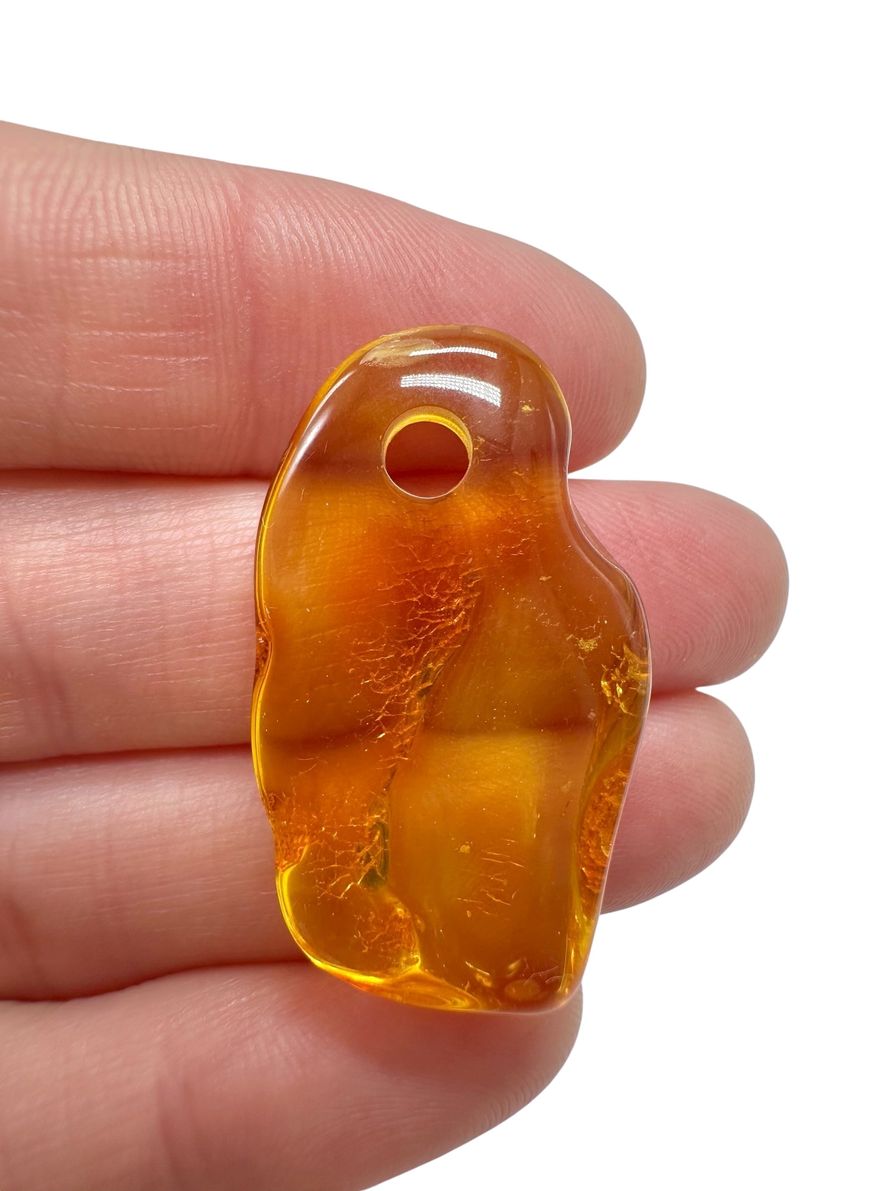 Amber with a drilled hole for hanging 2,2g – Lithuania - JND58