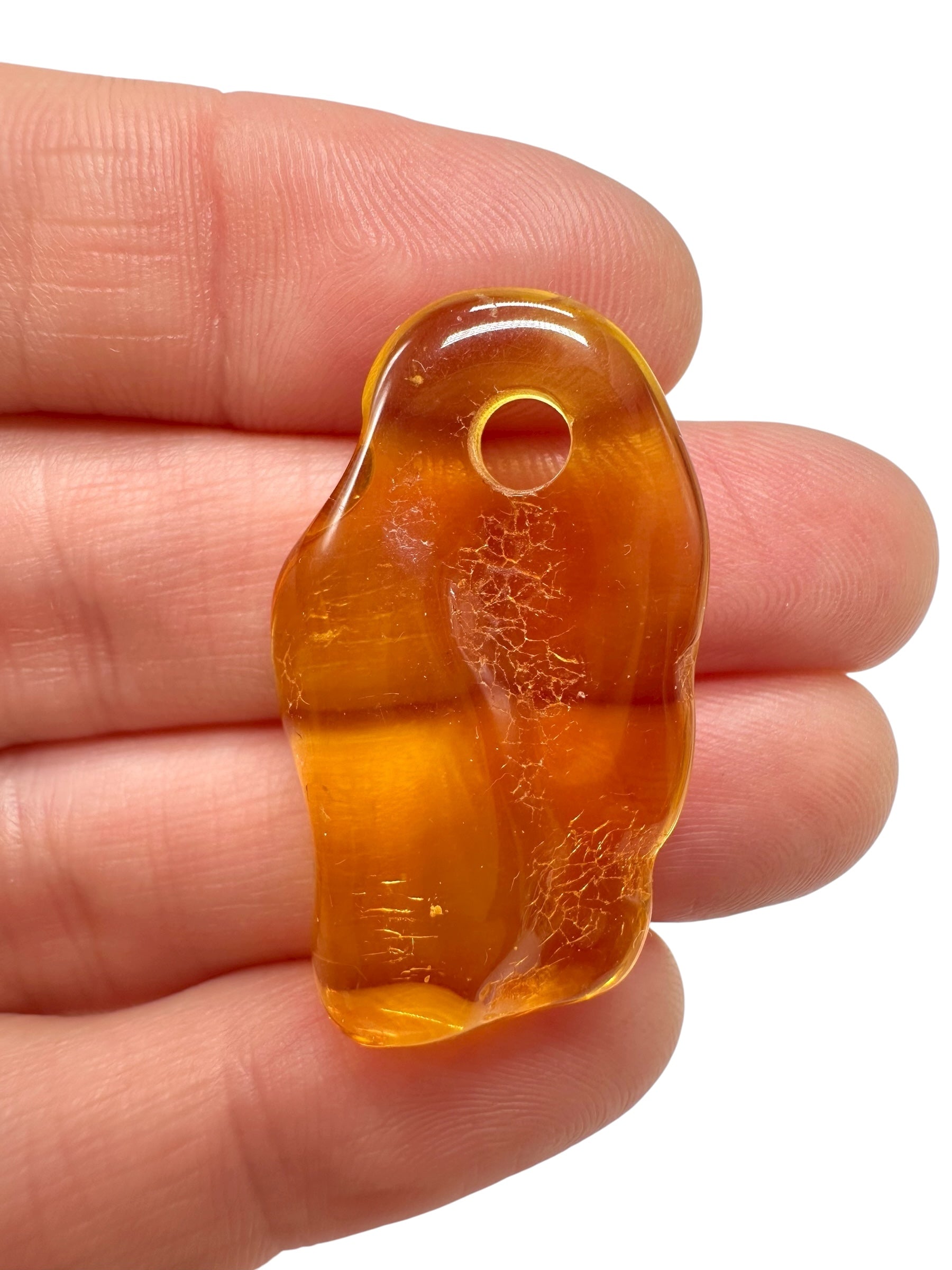 Amber with a drilled hole for hanging 2,2g – Lithuania