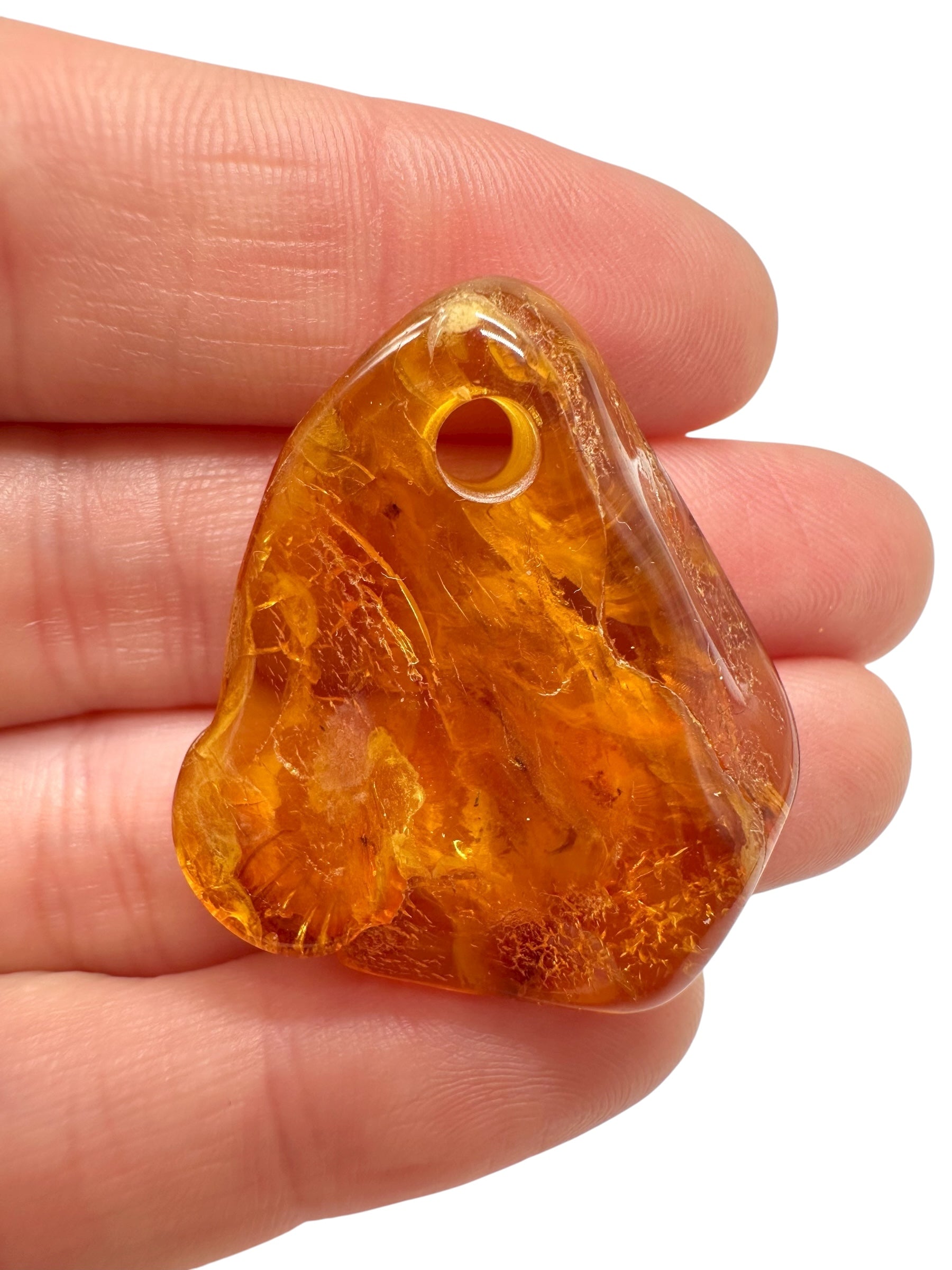 Amber with a drilled hole for hanging 3,8g – Lithuania