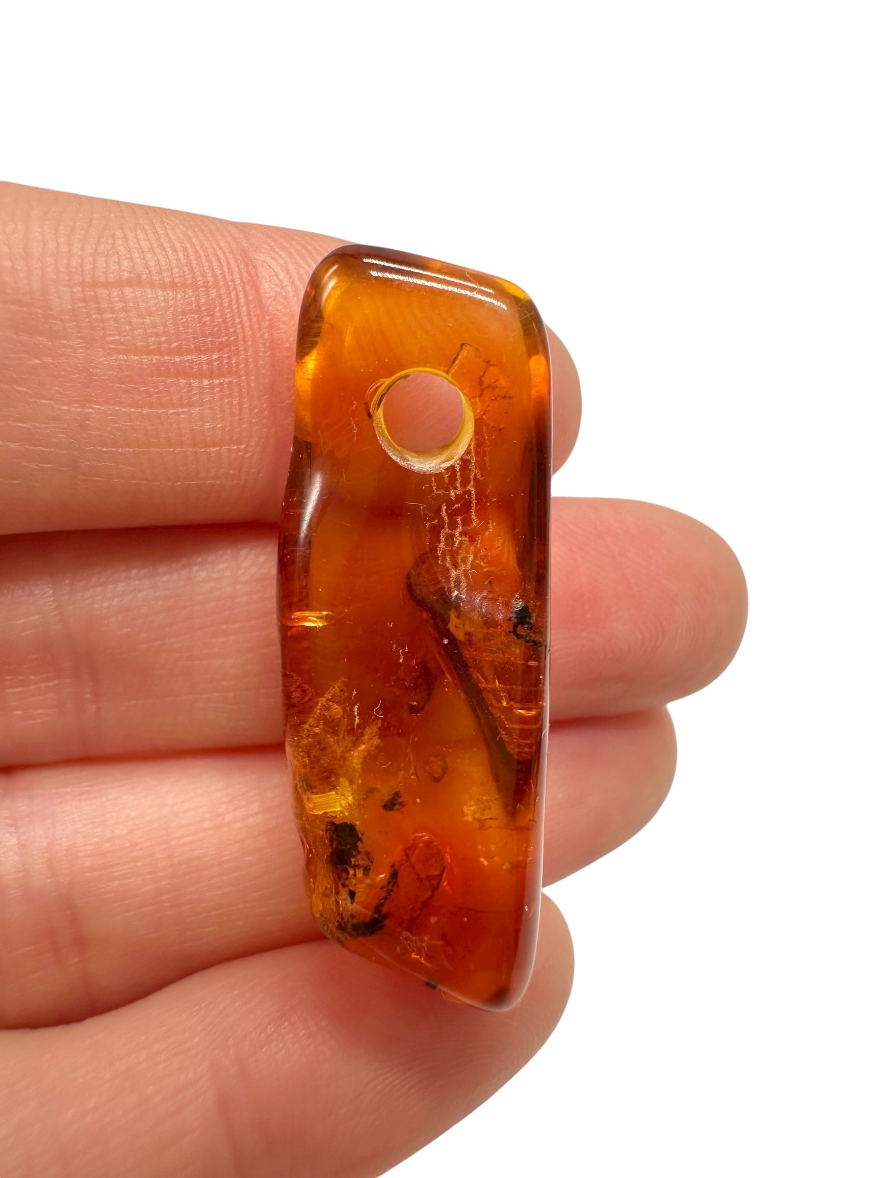 Amber with a drilled hole for hanging 3g – Lithuania