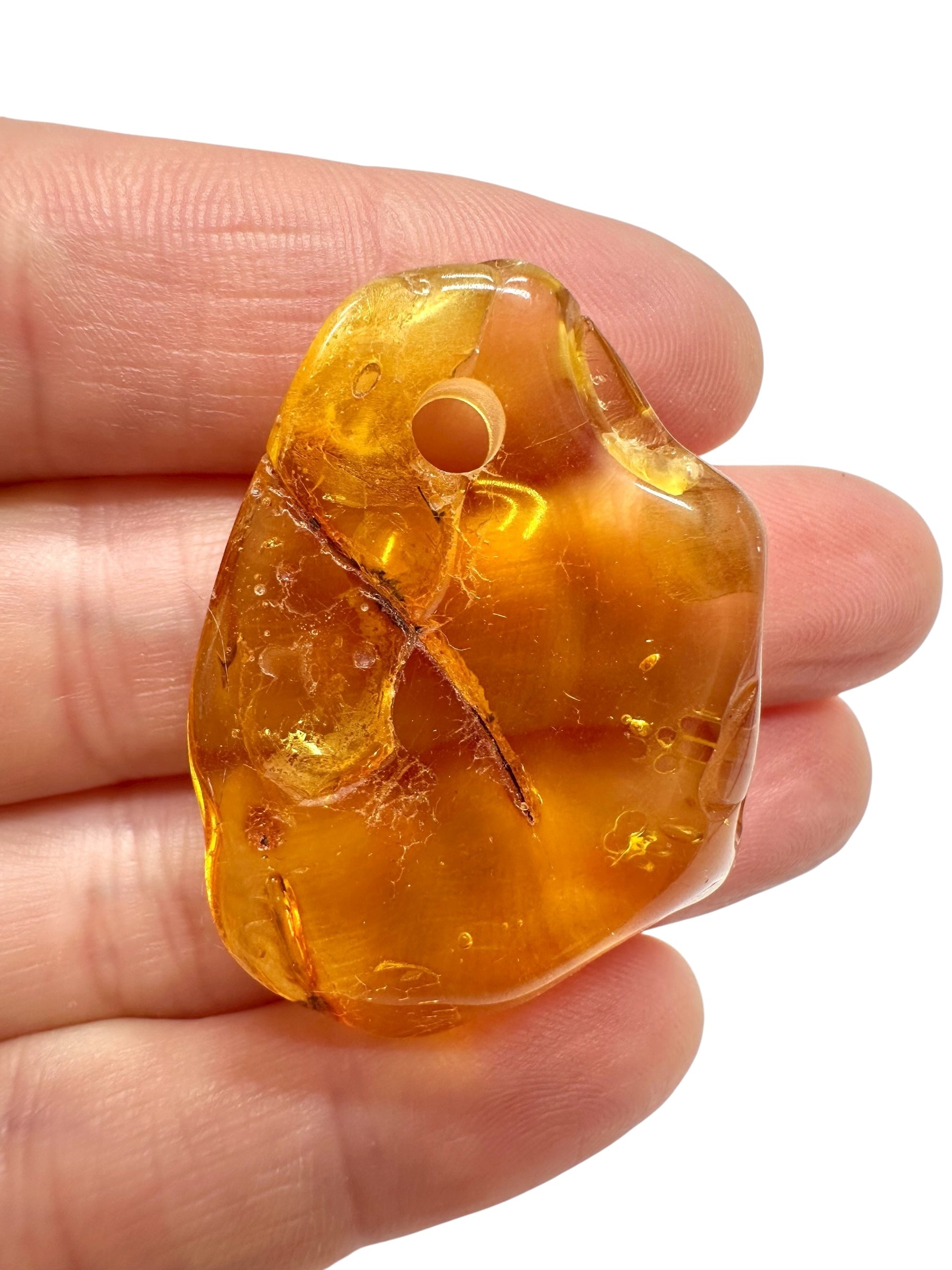 Amber with a drilled hole for hanging 4g – Lithuania