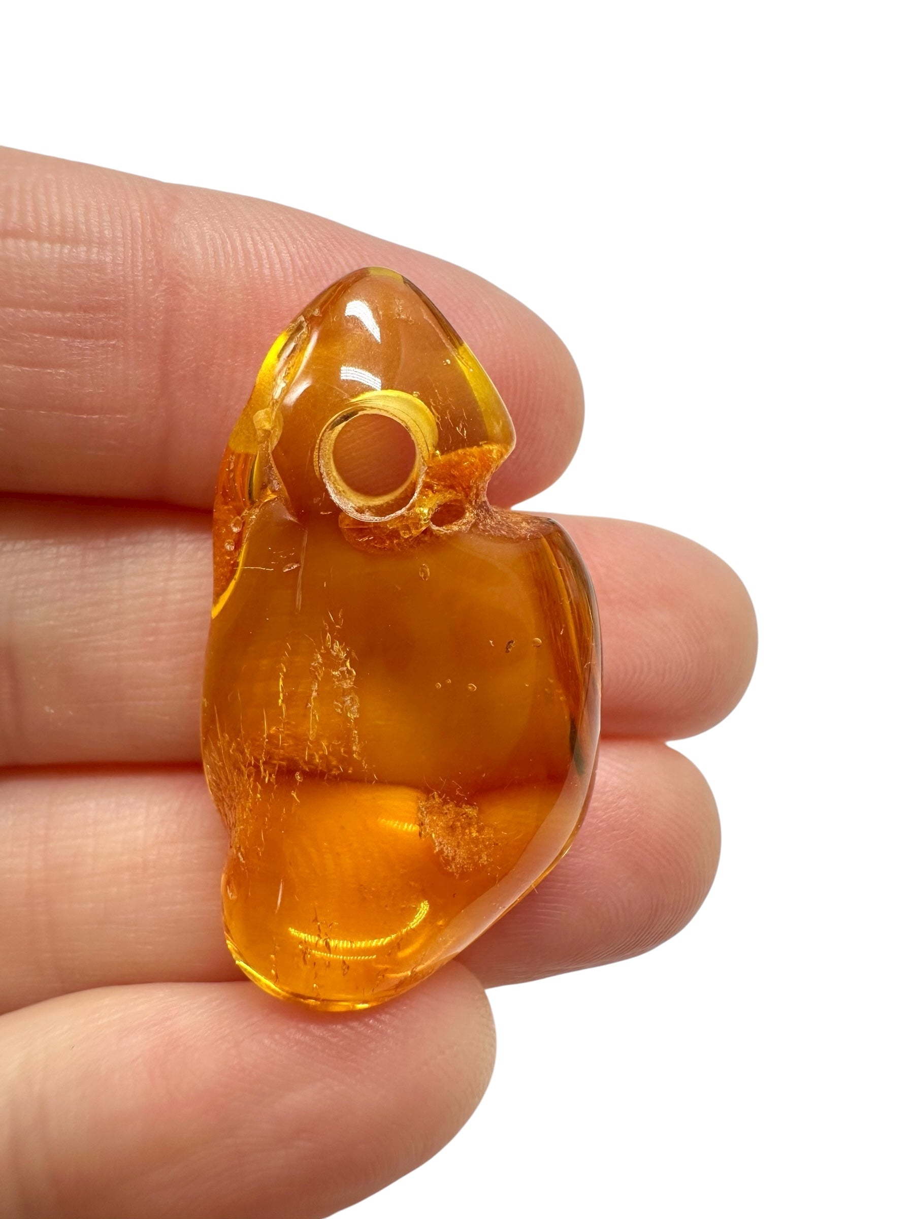 Amber with a drilled hole for hanging 2,8g – Lithuania
