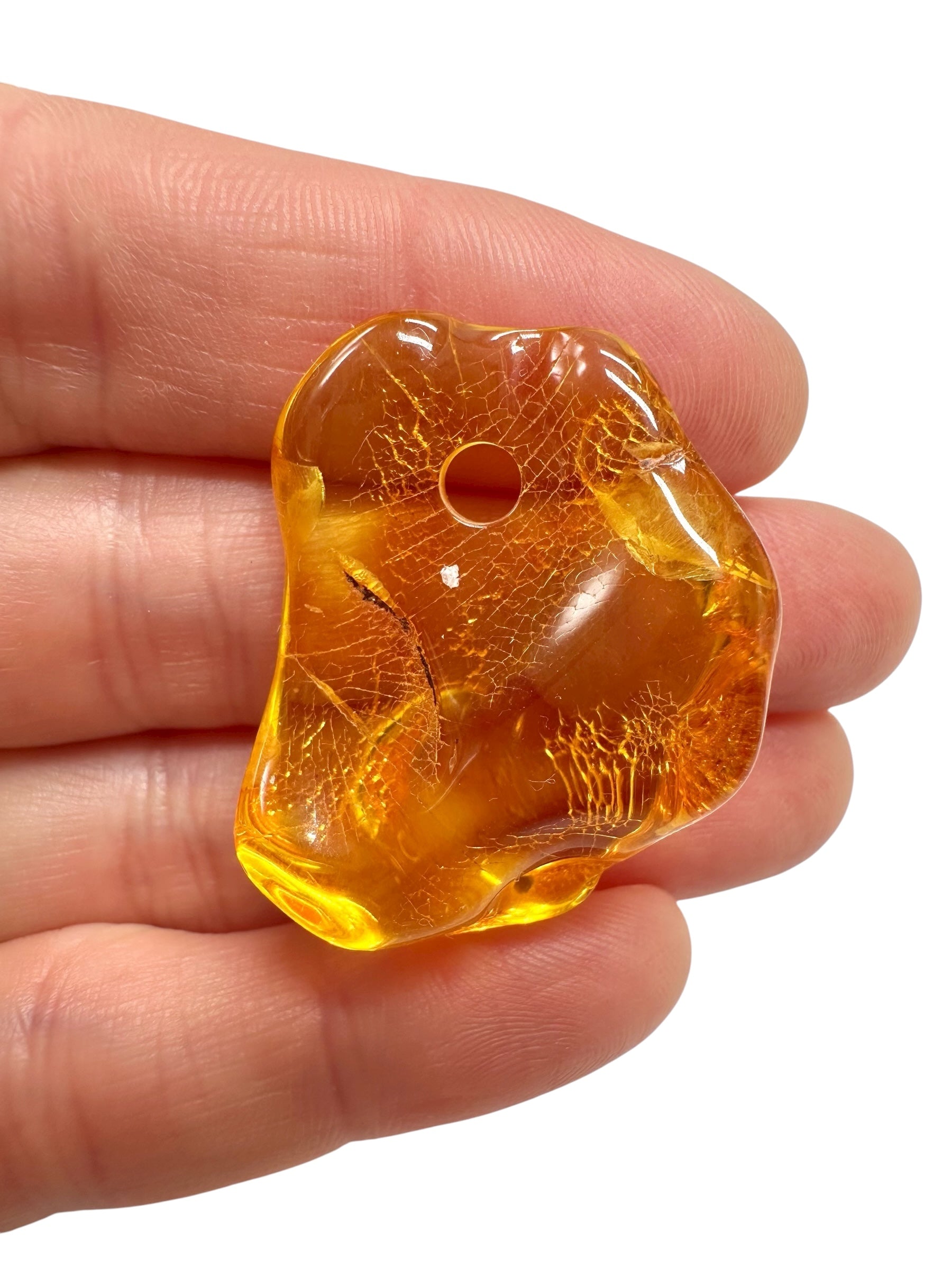 Amber with a drilled hole for hanging 4g – Lithuania