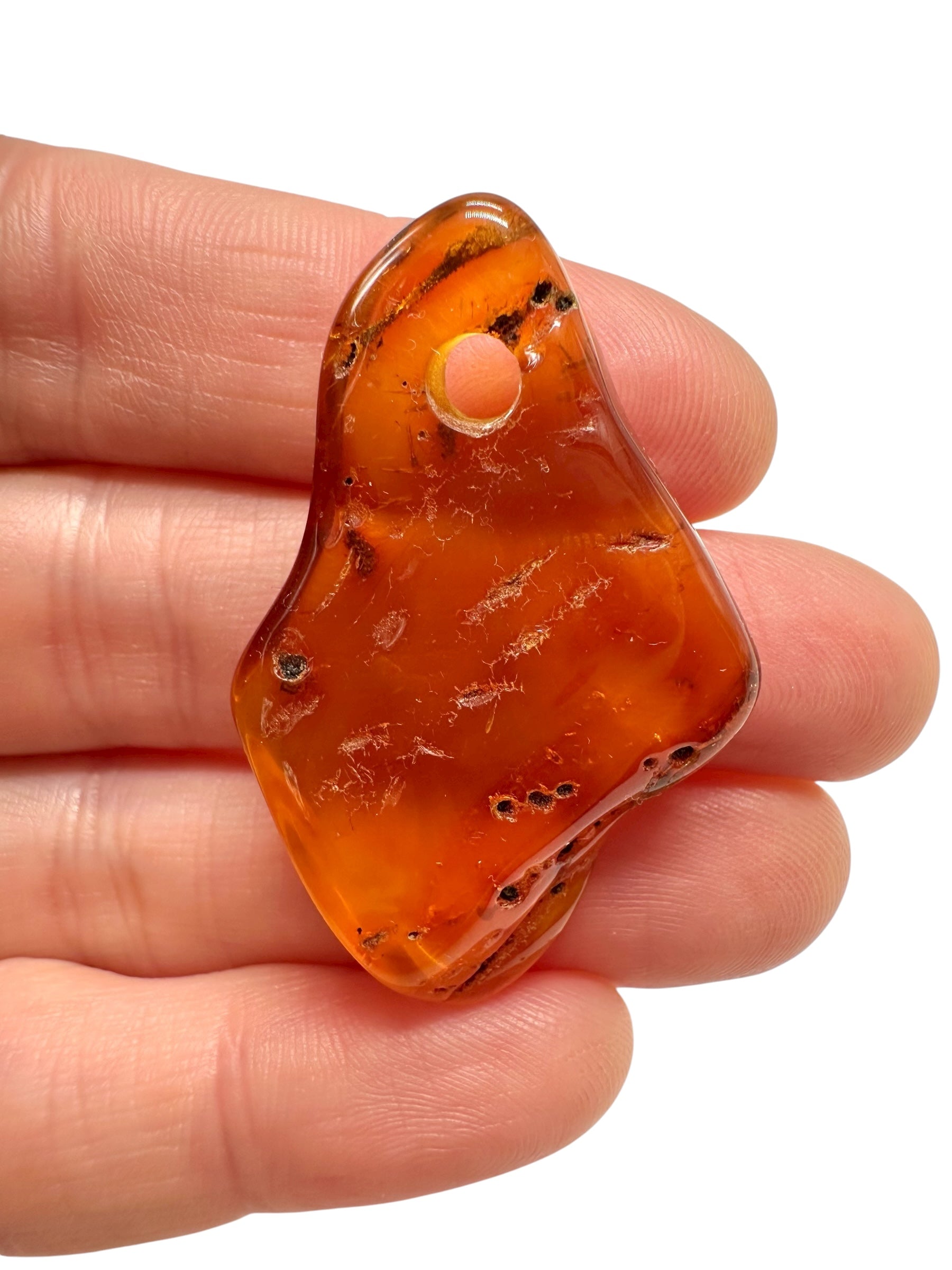 Amber with a drilled hole for hanging 3,6g – Lithuania