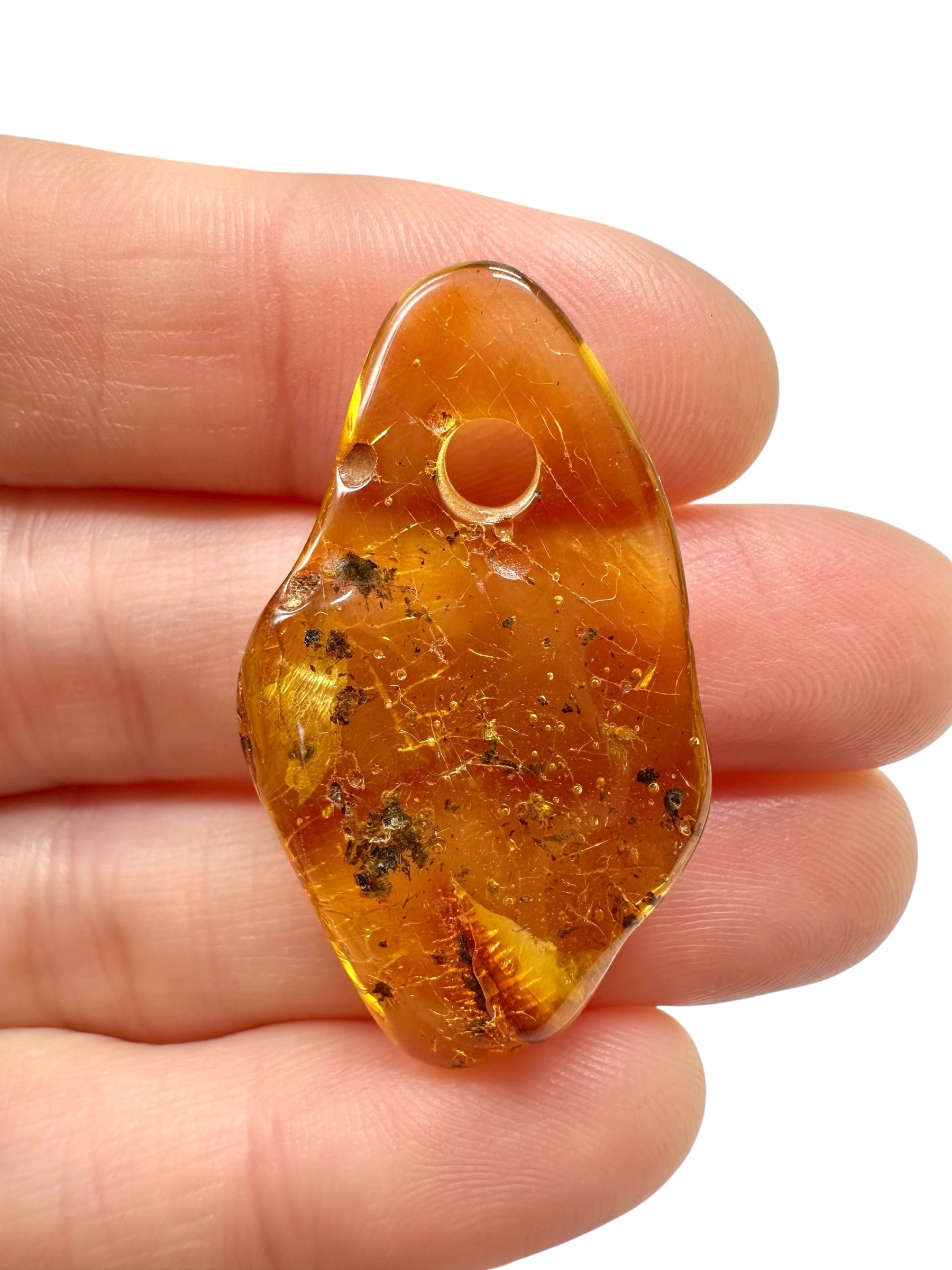 Amber with a drilled hole for hanging 2g – Lithuania - JND79