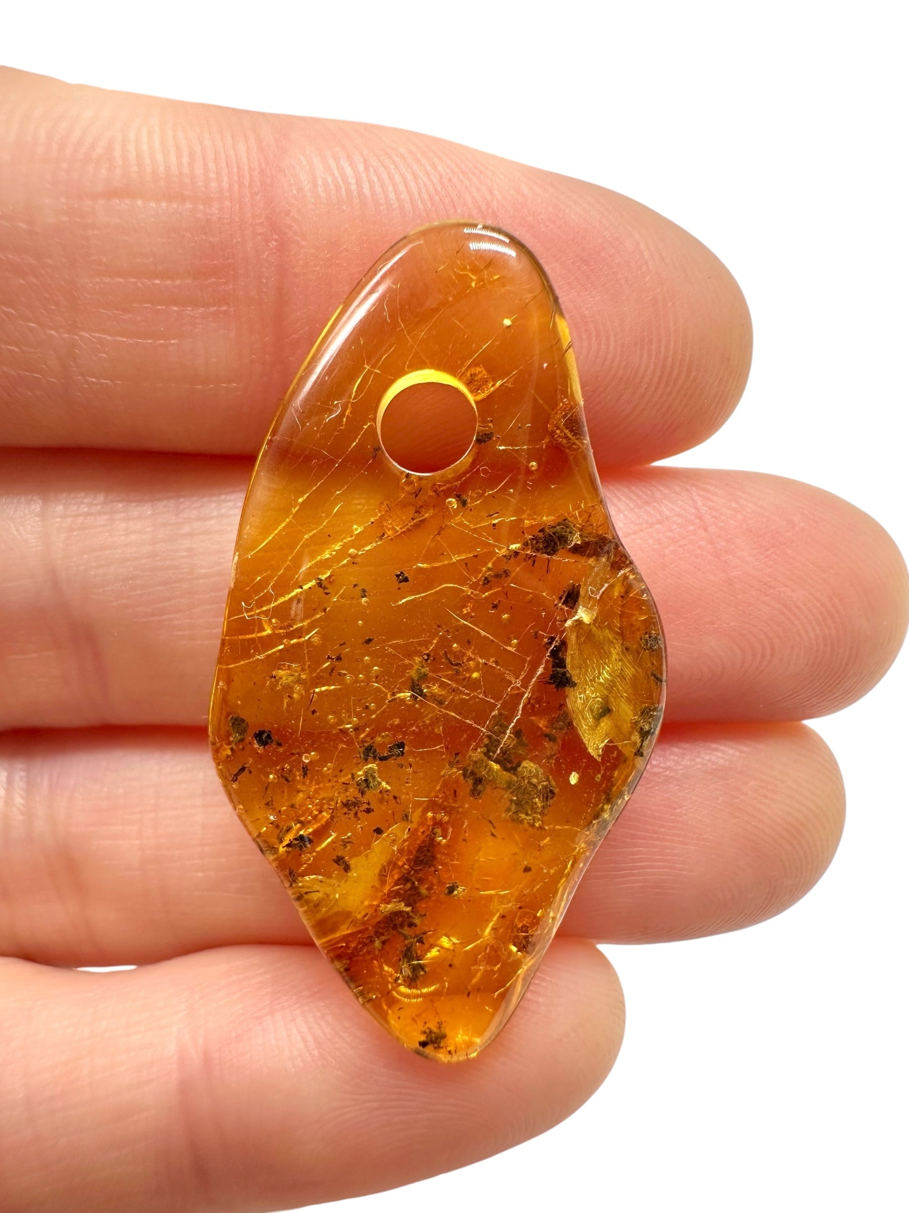 Amber with a drilled hole for hanging 2g – Lithuania