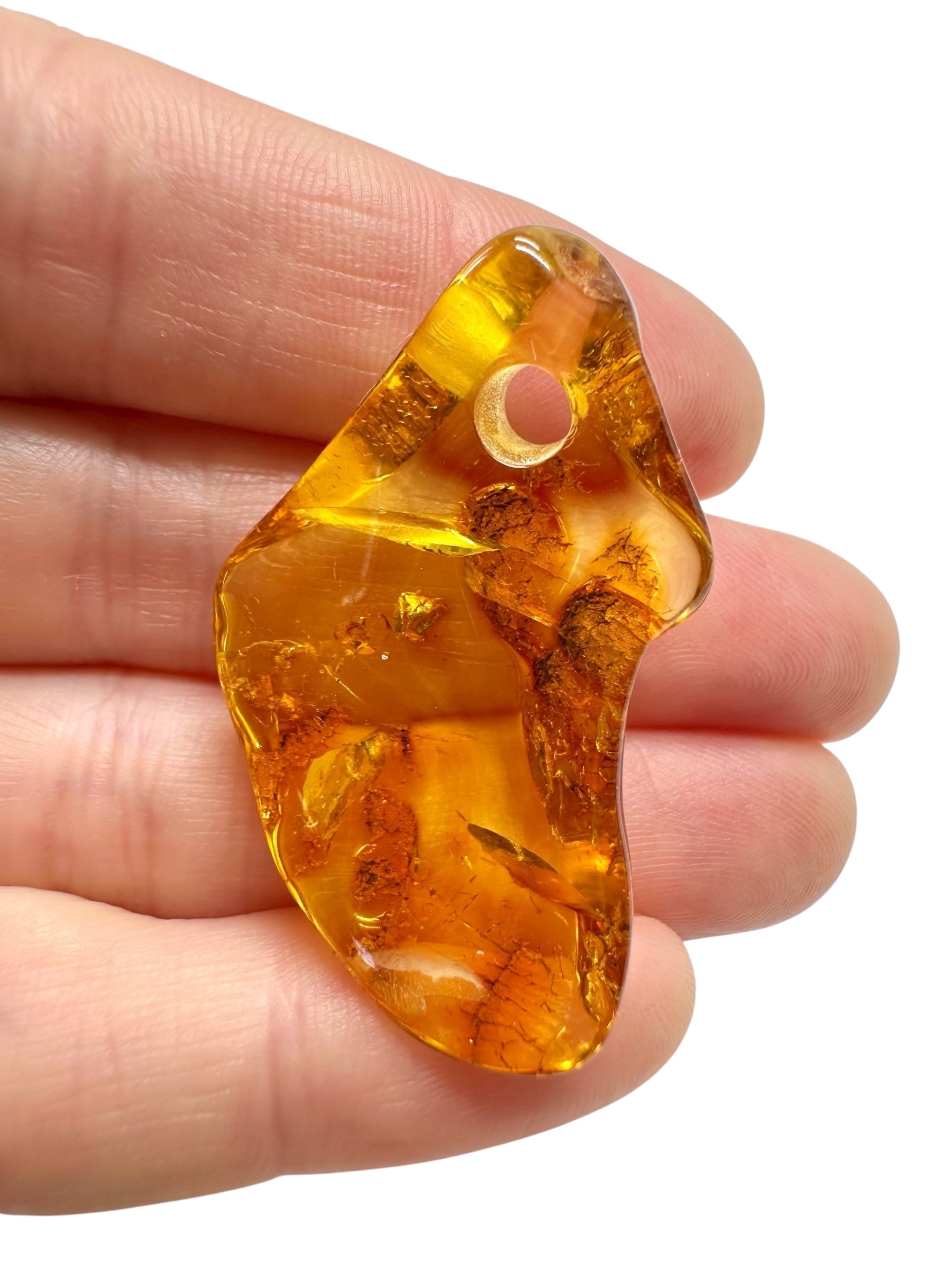 Amber with a drilled hole for hanging 3,1g – Lithuania