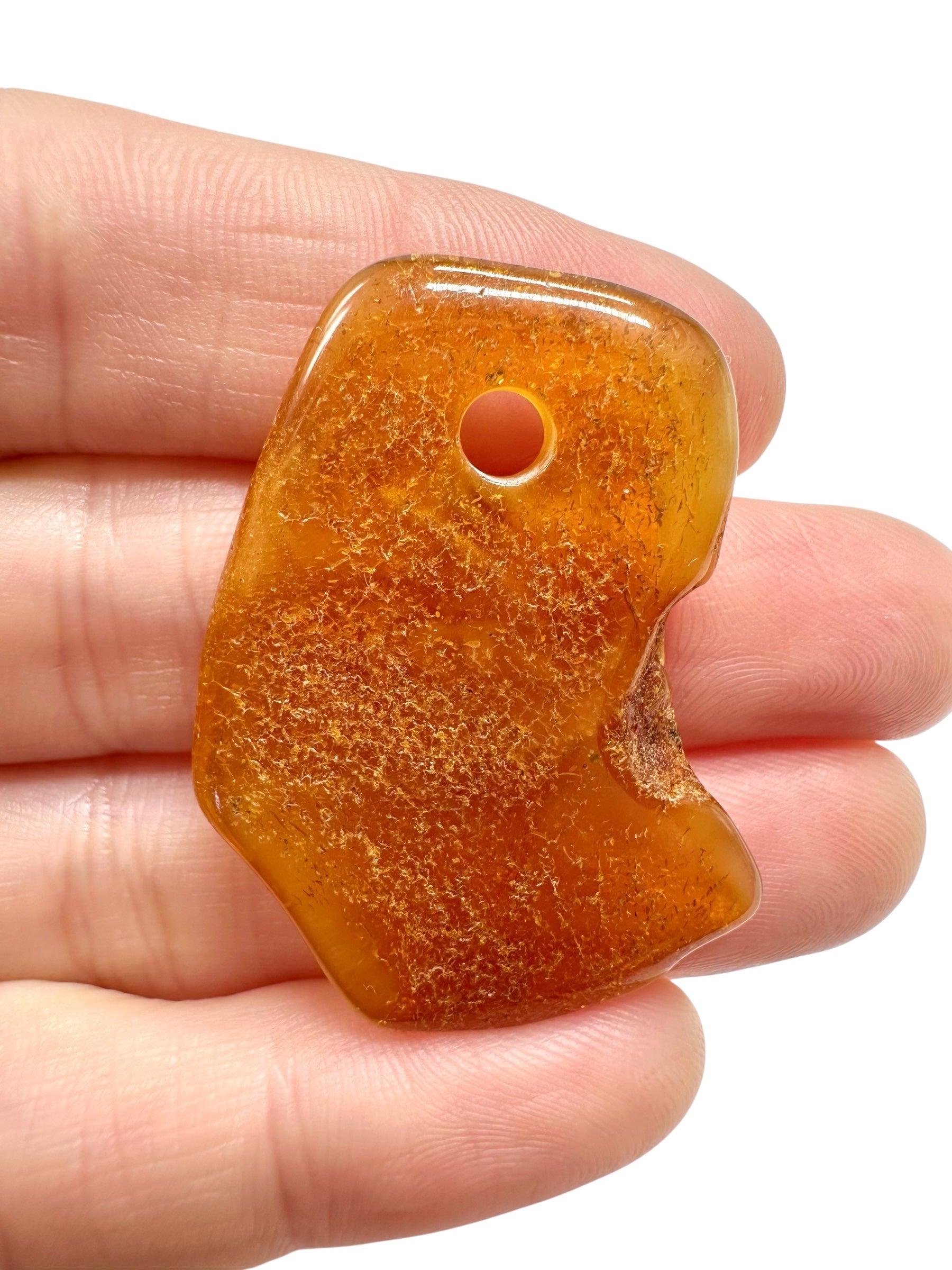 Amber with a drilled hole for hanging 3,2g – Lithuania