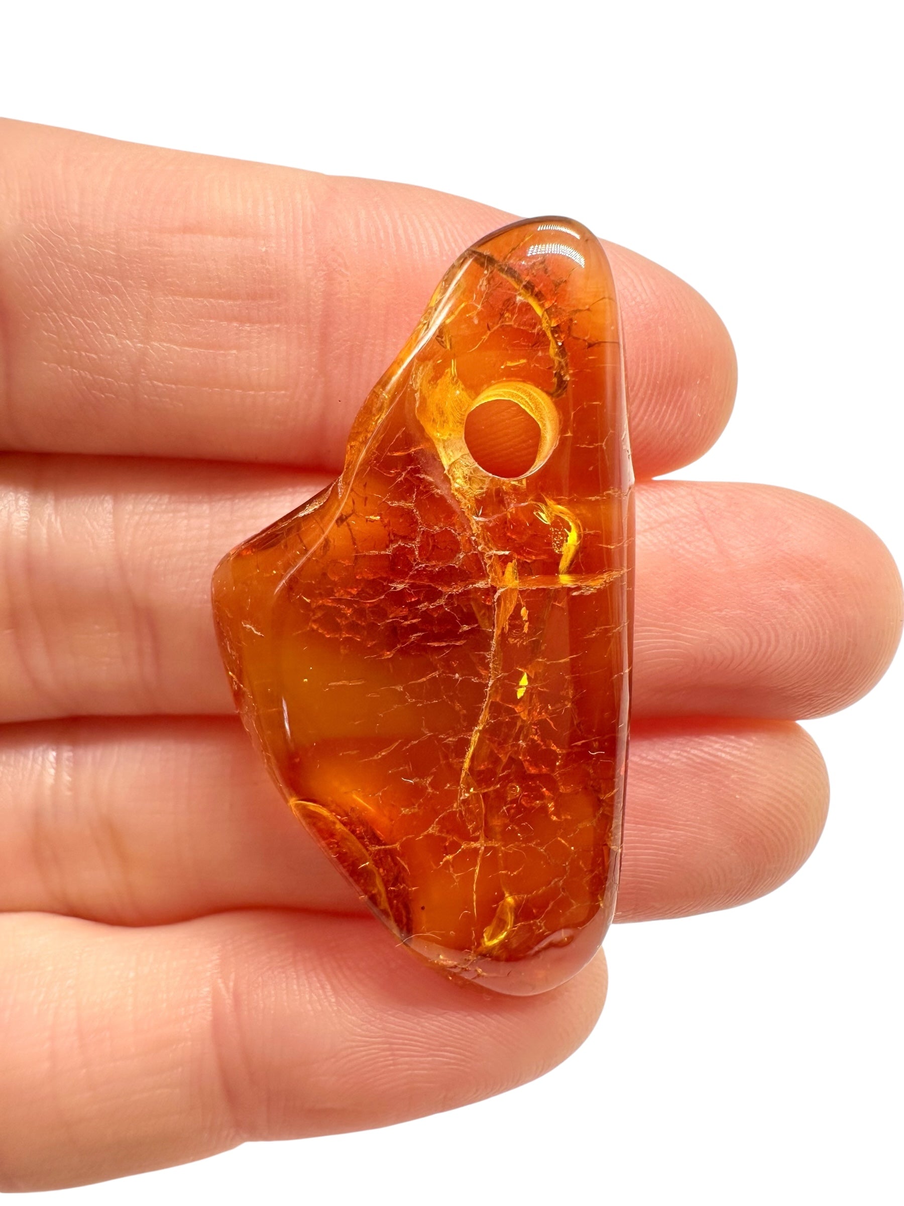Amber with a drilled hole for hanging 2,7g – Lithuania