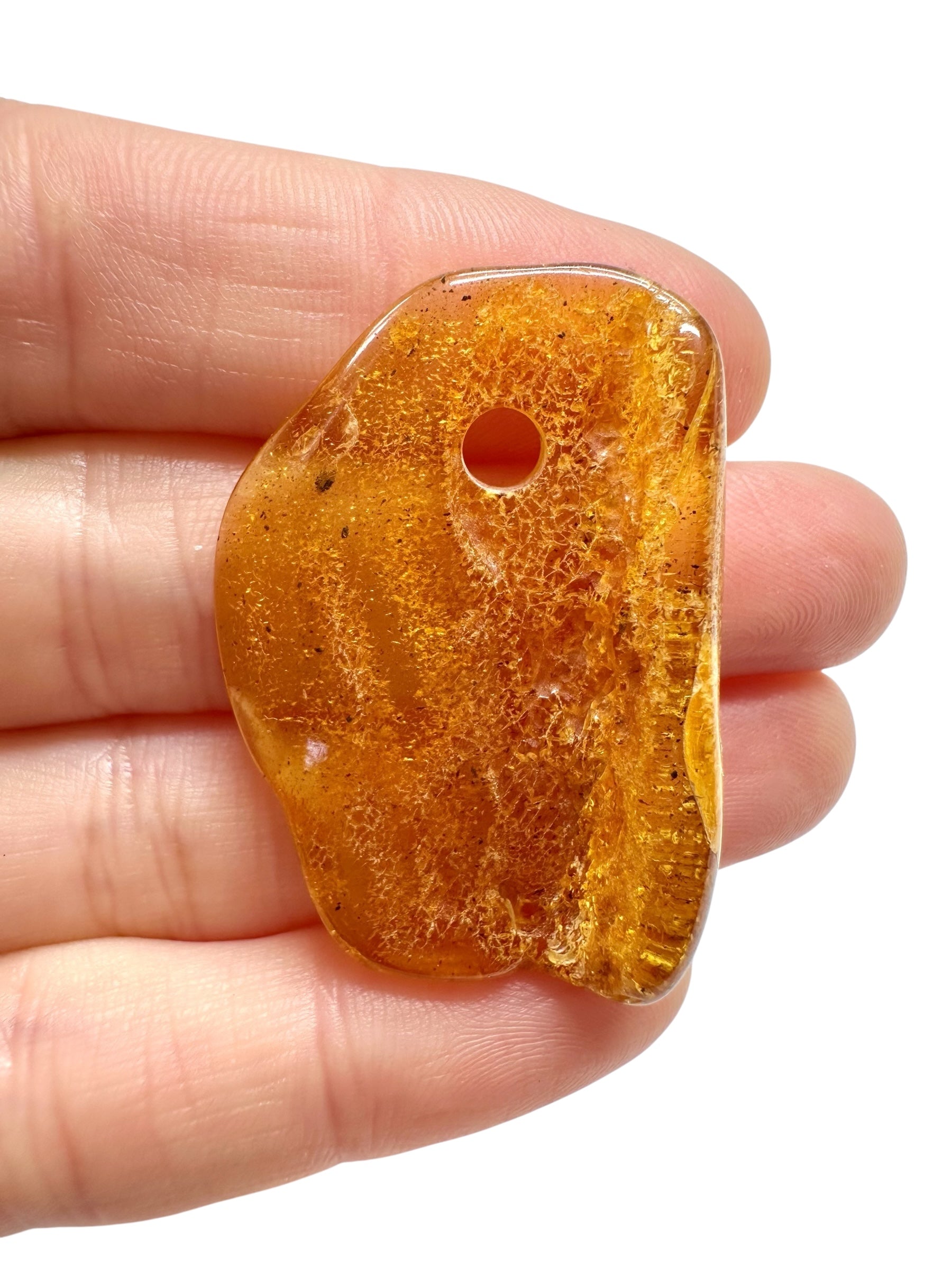 Amber with a drilled hole for hanging 3,2g – Lithuania