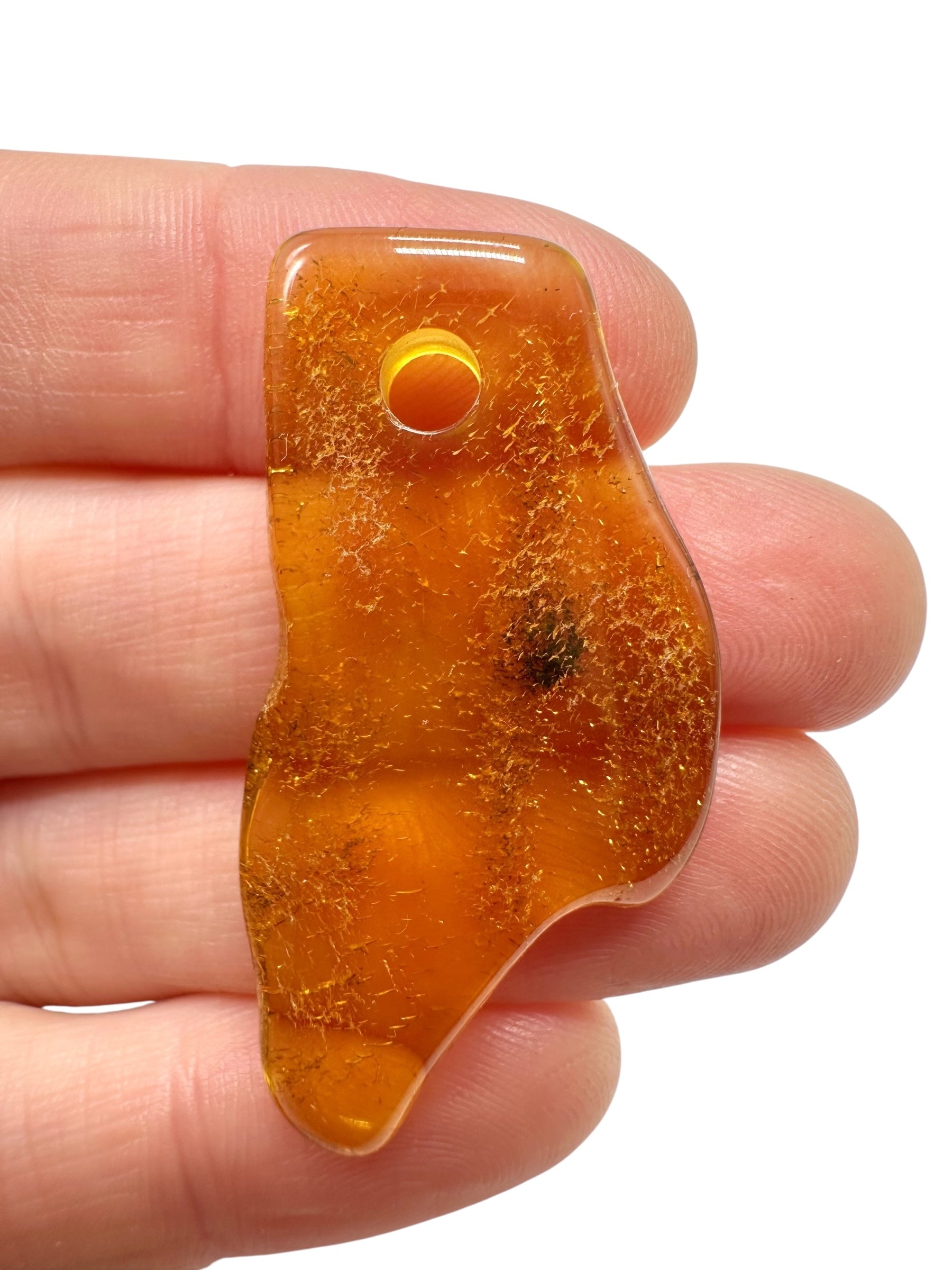 Amber with a drilled hole for hanging 2,6g – Lithuania