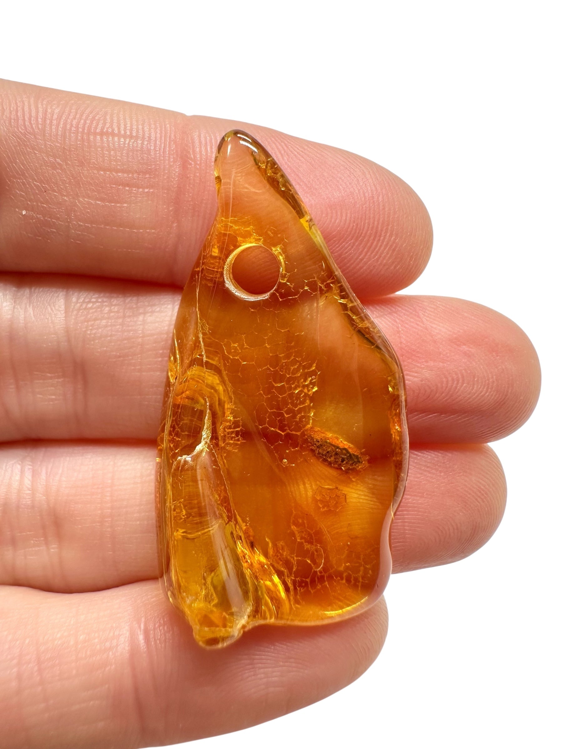 Amber with a drilled hole for hanging 2,8g – Lithuania