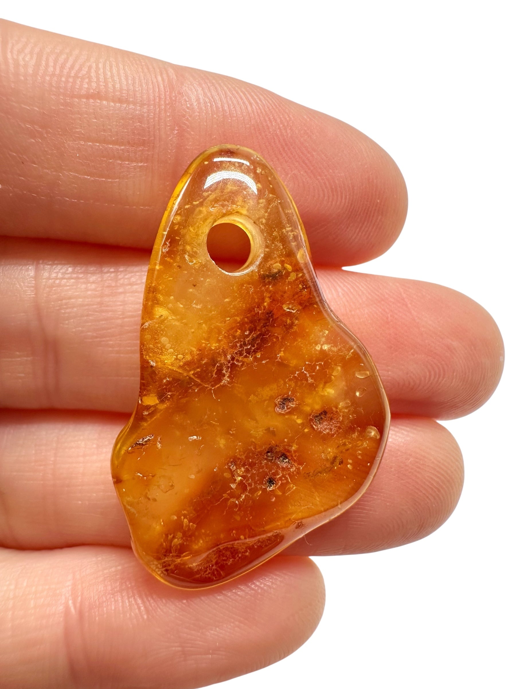 Amber with a drilled hole for hanging 2,3g – Lithuania - JND96