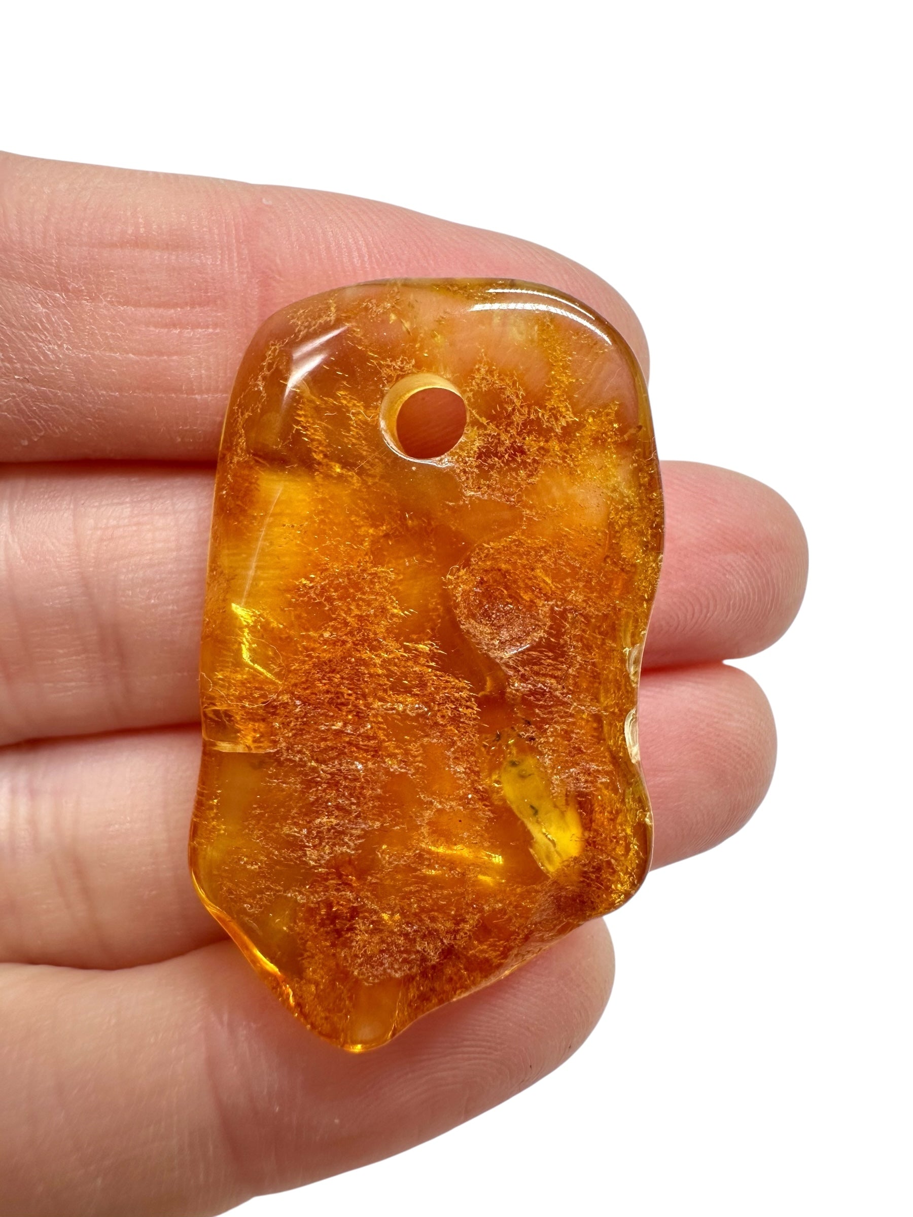 Amber with a drilled hole for hanging 3,1g – Lithuania