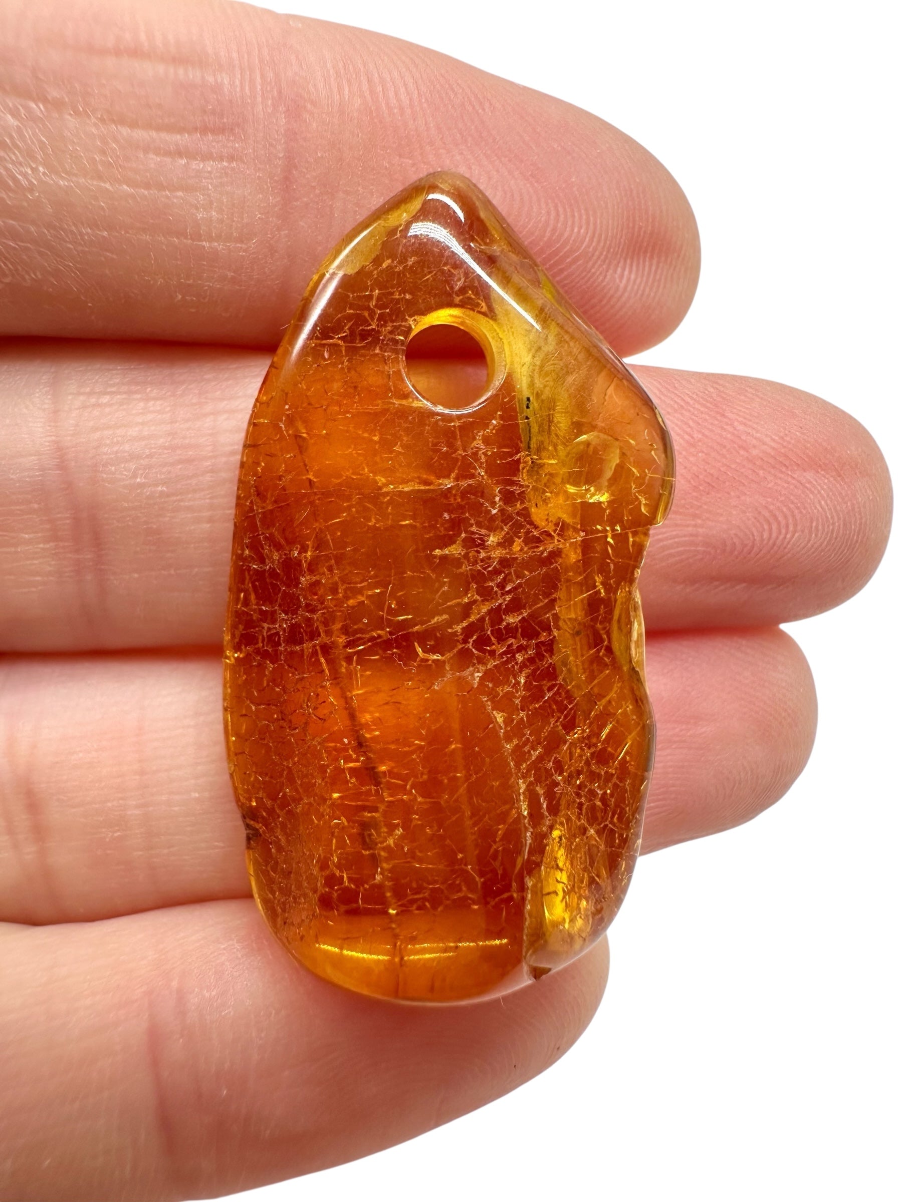 Amber with a drilled hole for hanging 2,7g – Lithuania