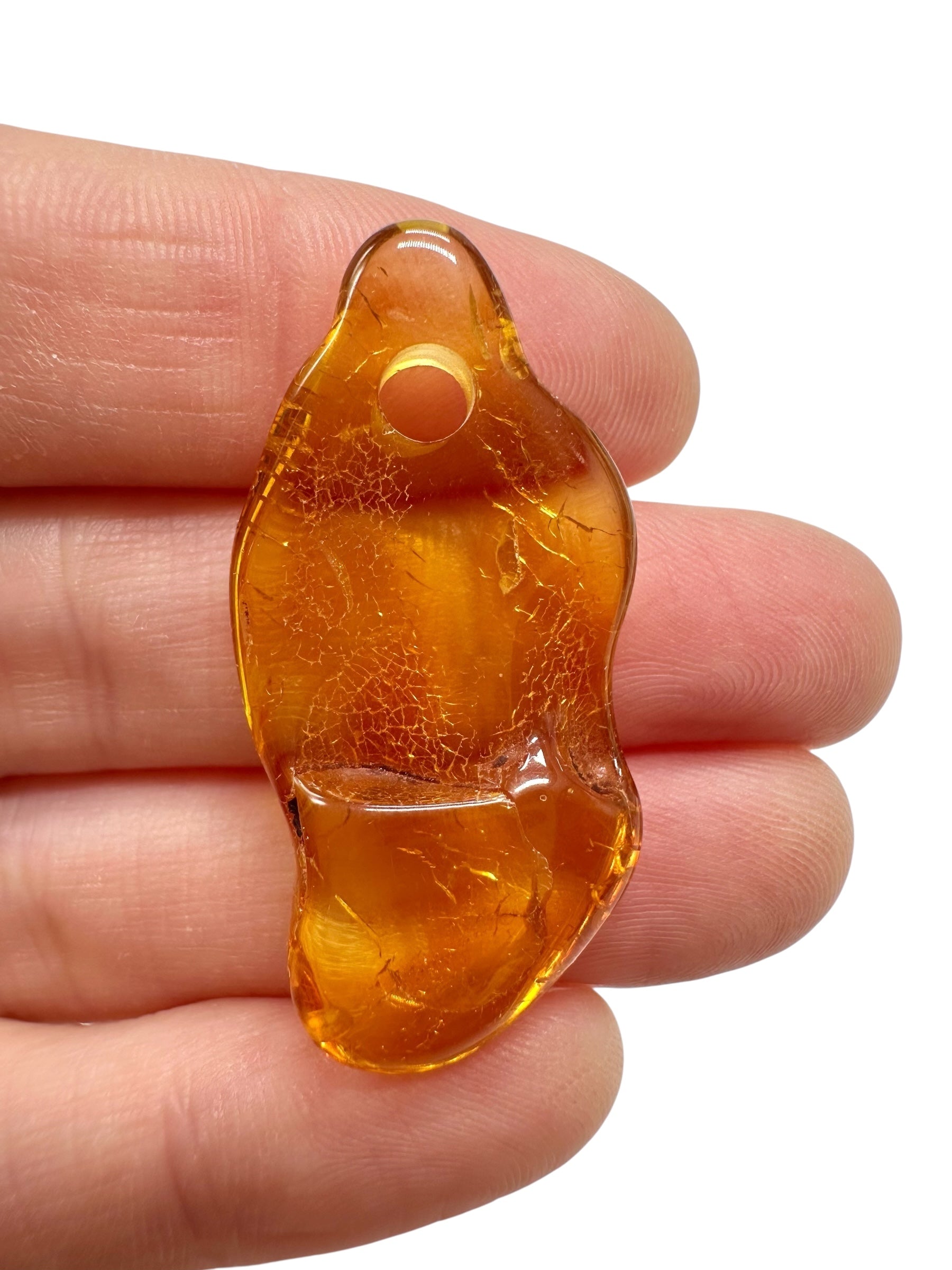 Amber with a drilled hole for hanging 2,2g – Lithuania - JND103
