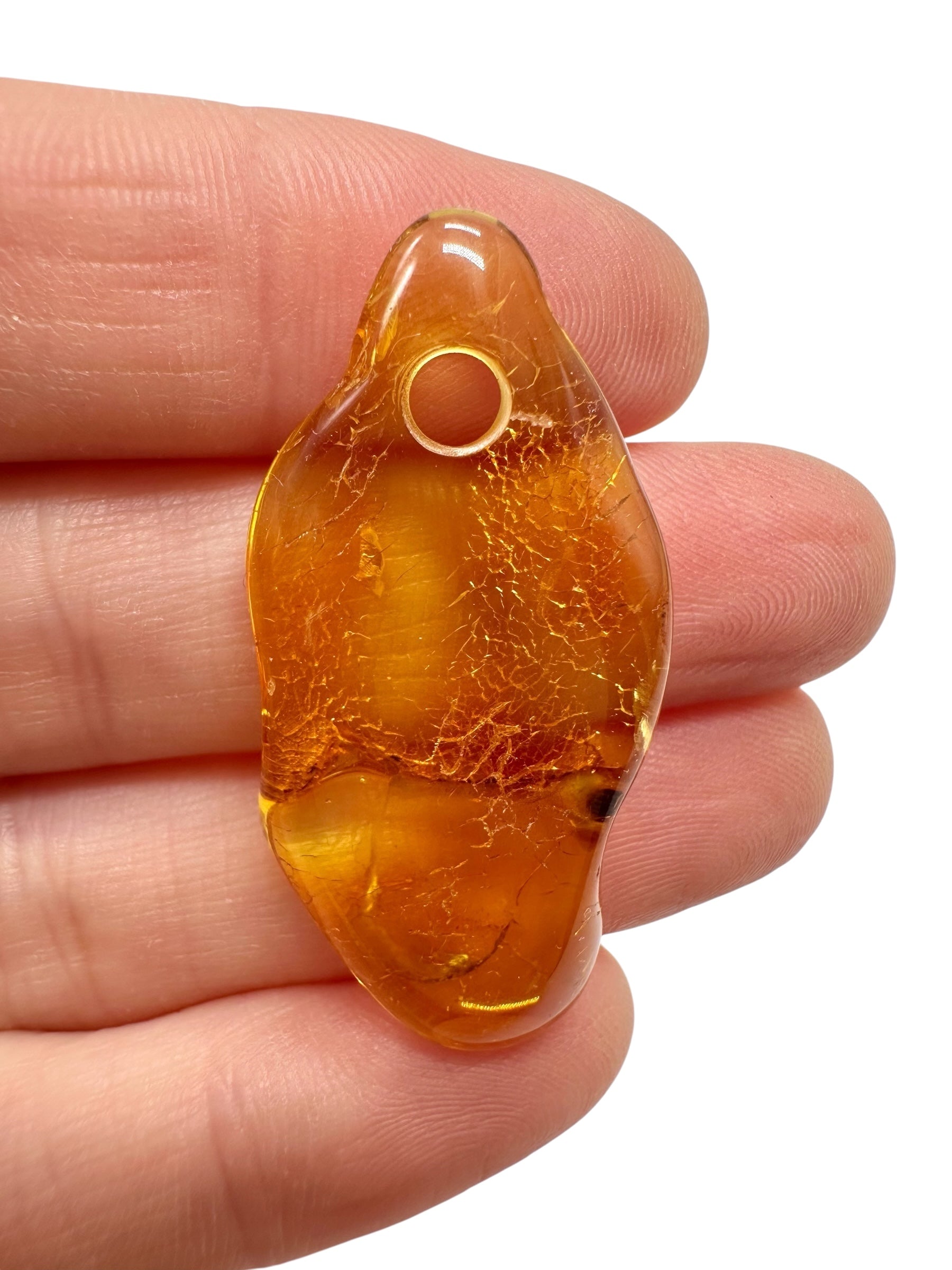 Amber with a drilled hole for hanging 2,2g – Lithuania