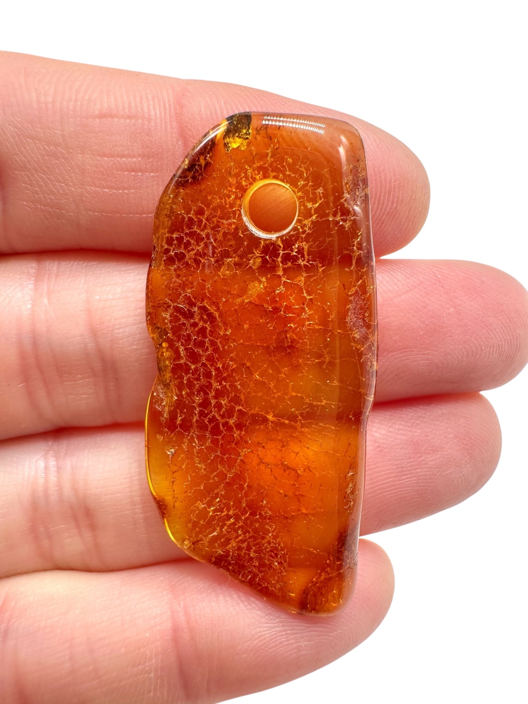 Amber with a drilled hole for hanging 2,8g – Lithuania